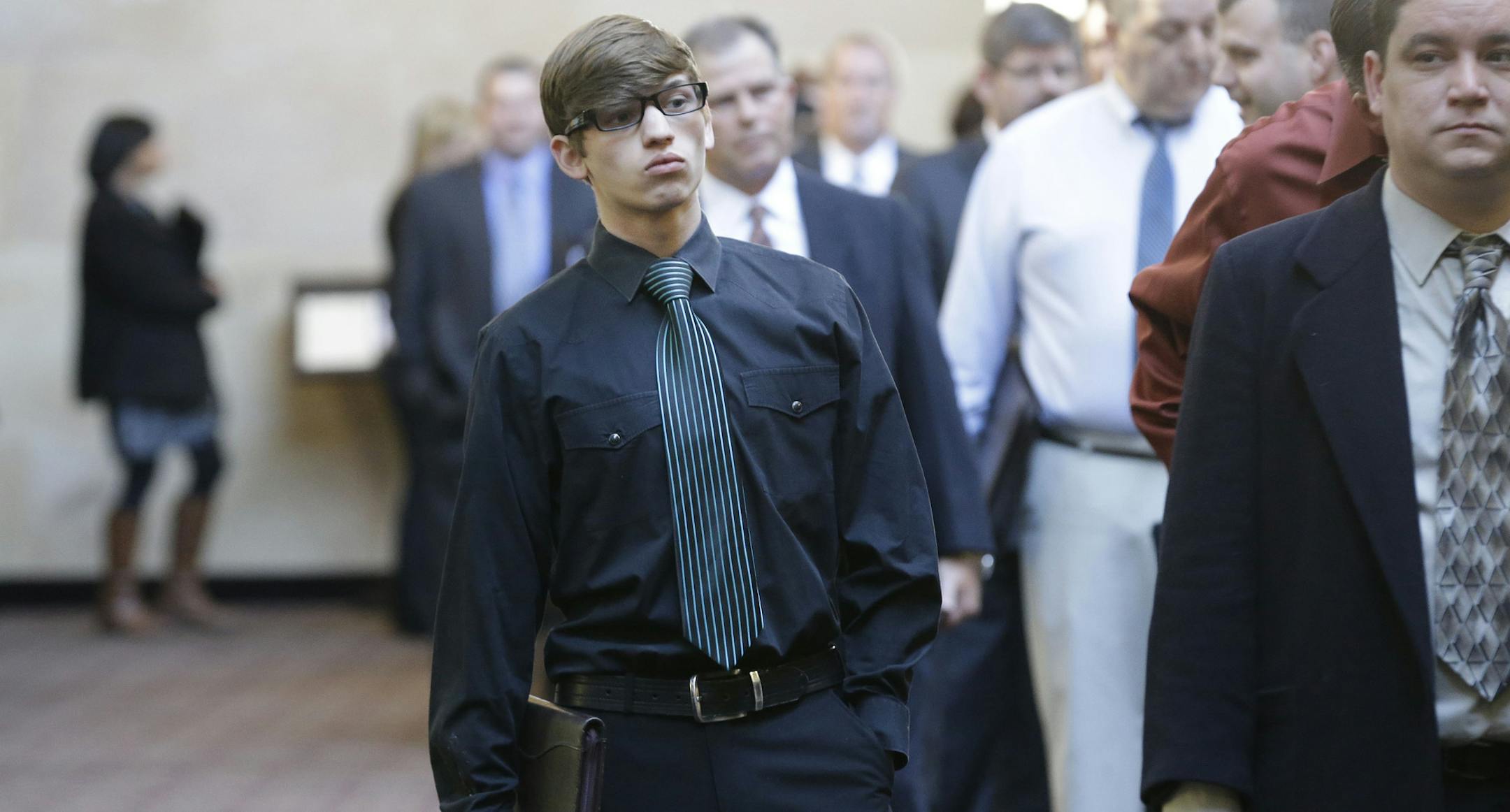 In this Wednesday, Jan. 22, 2014, photo, Austin Moore, 18, lines up with other job seekers during a career fair at a hotel in Dallas. Fears of an economic slowdown are heightening anticipation of what U.S. jobs report for January might reveal. (AP Photo/LM Otero)