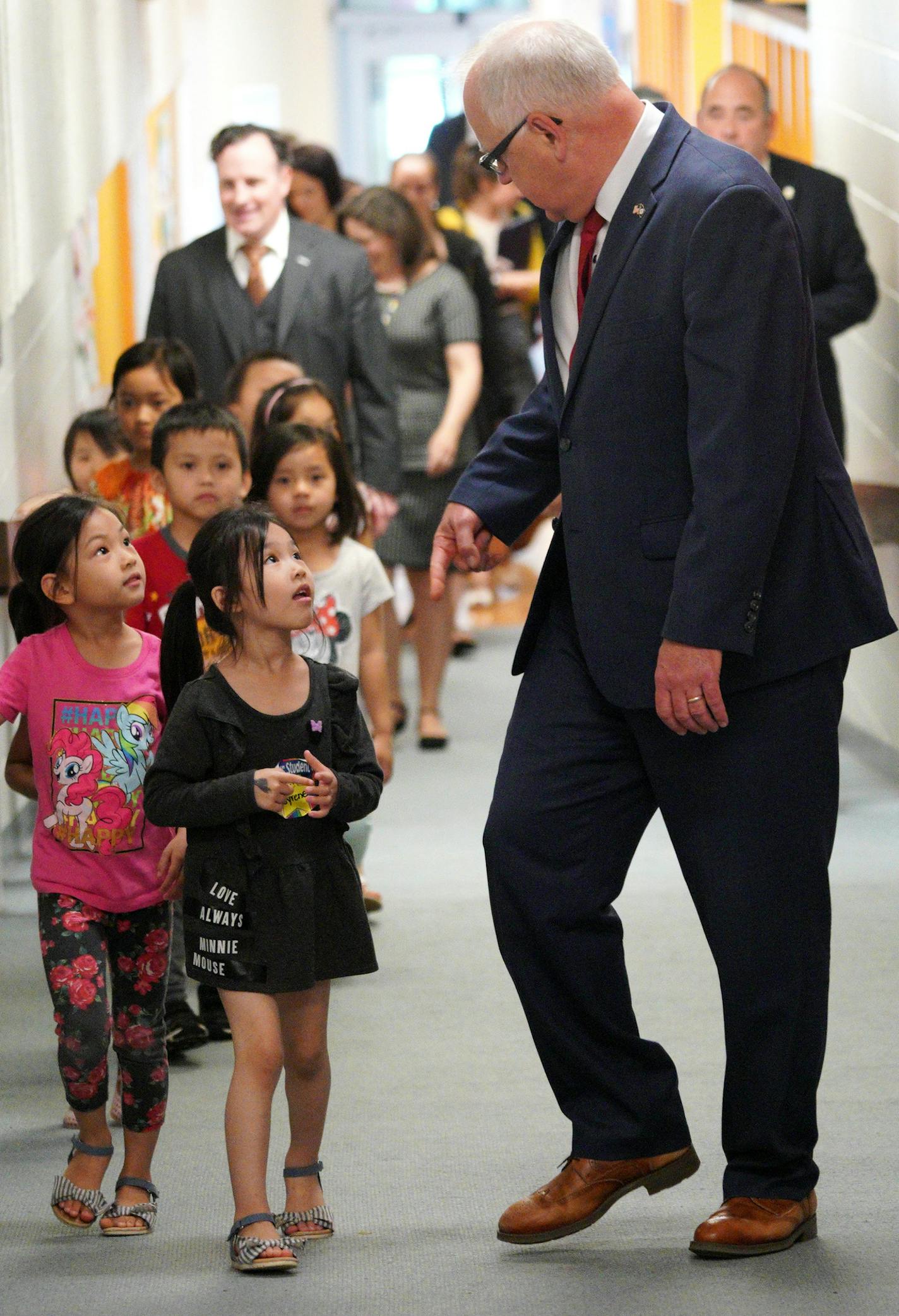 Governor Tim Walz walks into a press conference with Pre-K children, including Syrene (center black dress), from Bruce Vento Elementary School Thursday afternoon. ] Gov. Tim Walz signed the school funding bill into law at a Bruce Vento Elementary School in St. Paul, and announced his intent to sign off on all the major budget bills completed during the special session.
brian.peterson@startribune.com
St. Paul, MN Thursday, May 30, 2019