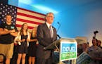 Republican governor candidate Doug Burgum talks to supporters at an art gallery in downtown Fargo, N.D., after Burgum won the GOP primary vote on Tues