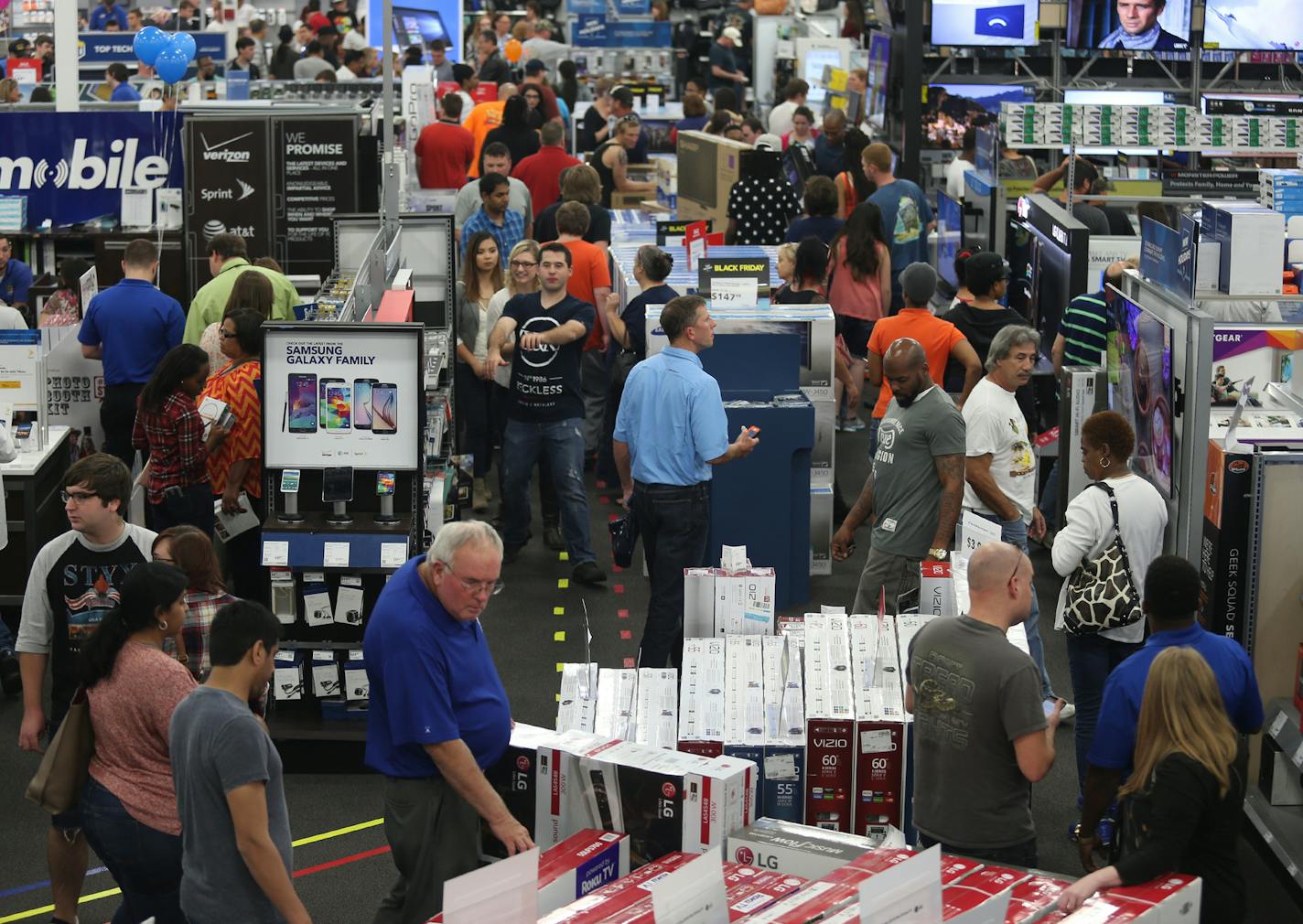 People look at merchandise while holiday shopping at Best Buy on Thursday, Nov. 26, 2015, in Panama City, Fla. Early numbers aren&#xcc;t out yet on how many shoppers headed to stores on Thanksgiving, but it&#xcc;s expected that more than three times the number of people will venture out to shop on the day after the holiday known as Black Friday. (Patti Blake/News Herald via AP) MANDATORY CREDIT ORG XMIT: MIN2015121812543936 ORG XMIT: MIN1512181459460994