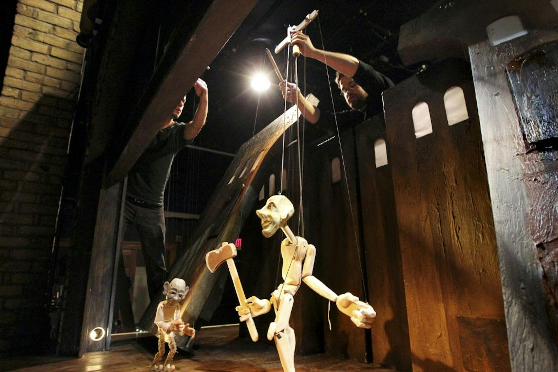 Kyle Loven, left, and Justin Spooner rehearsed Open Eye Figure Theatre's adaptation of "The Sorcerer's Apprentice."