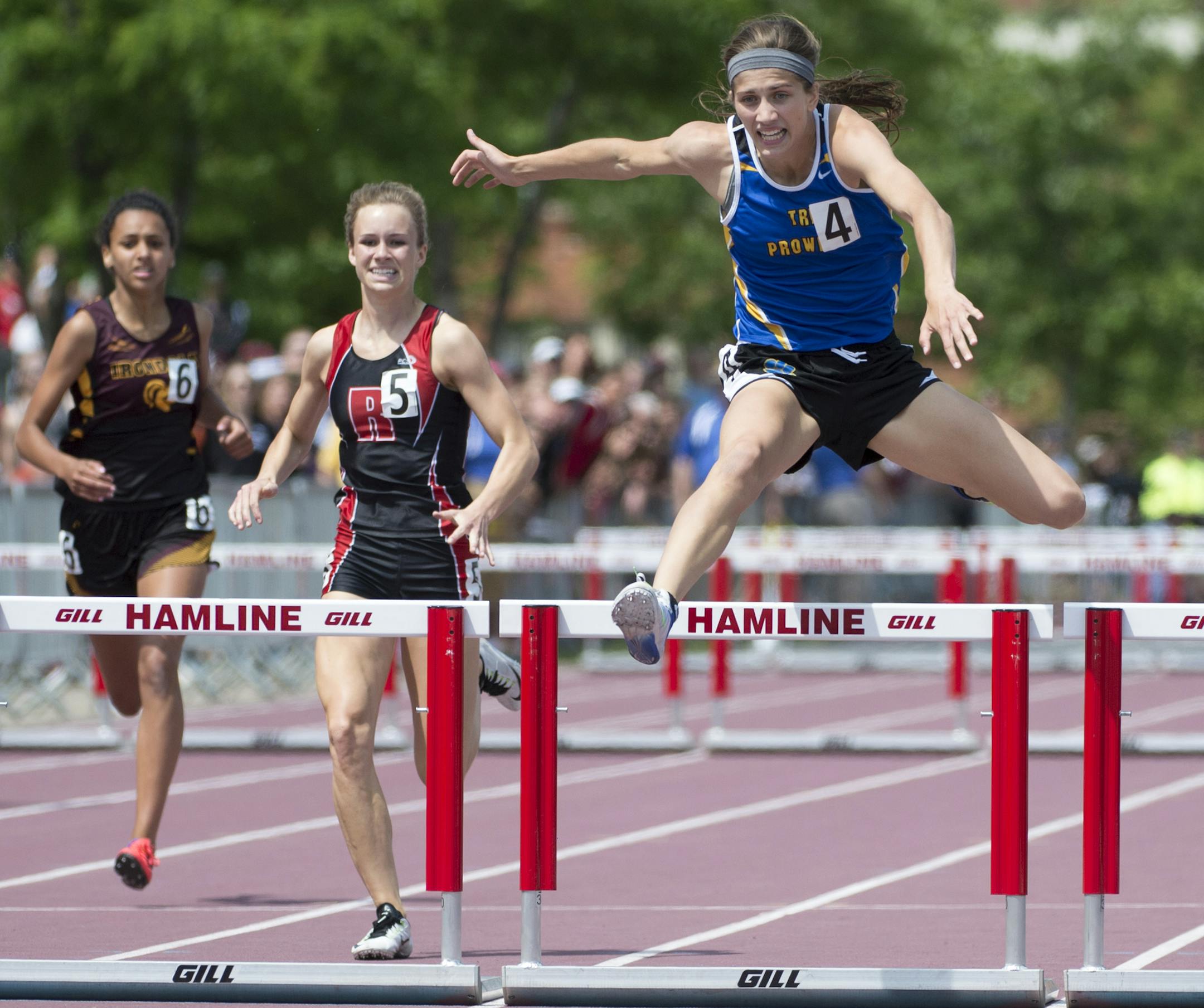 Maleah Biermaier, right, of Thief River Falls, won the state title in the 2A 300 meter hurdles with an all-time record breaking time of 42.13 Saturday. ] Aaron Lavinsky • aaron.lavinsky@startribune.com The Class 1A and 2A state track meets were held Saturday, June 6, 2015 at Hamline University in St. Paul.
