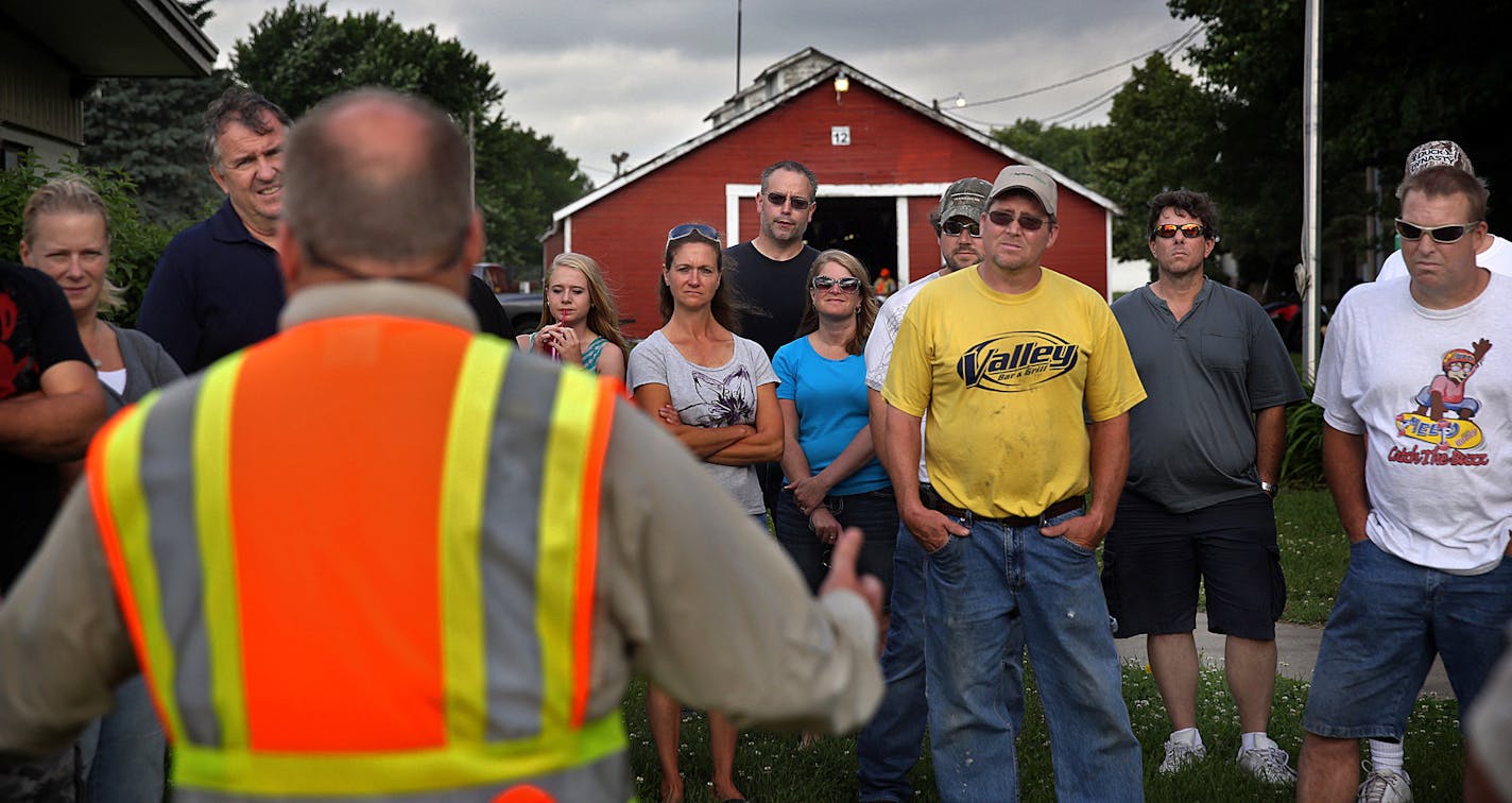 Safety instructor Jay Peterson (back to camera), president of the South Metro ATV Club, addressed parents of young ATV riders at the start of the DNR training class.] JIM GEHRZ &#x201a;&#xc4;&#xa2; jgehrz@startribune.com / Farmington, MN 6/28, 2014 / 9:00 AM / BACKGROUND INFORMATION: The Minnesota DNR conducted a training class for ATV riders, particularly aimed at younger riders at the Dakota County Fairgrounds in Farmington. Jay Peterson was among the instructors. This is hands on training wit