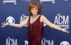 FILE - In a Sunday, April 7, 2019 file photo, Reba McEntire arrives at the 54th annual Academy of Country Music Awards at the MGM Grand Garden Arena, 