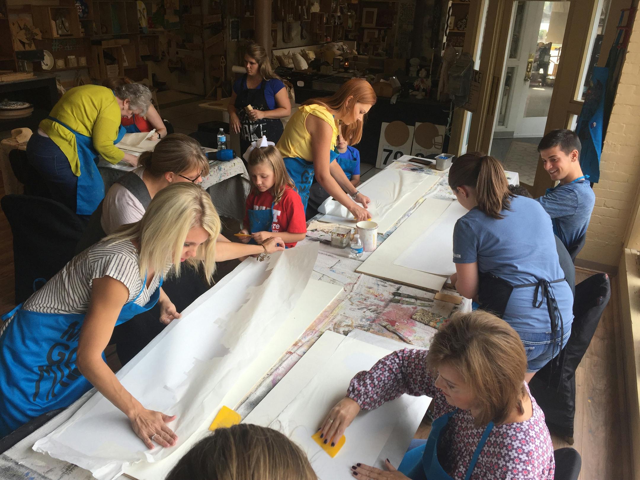 People work on eclipse-related pieces of art during a workshop at Make, 628 Broadway St. (Lori Rackl/Chicago Tribune/TNS)