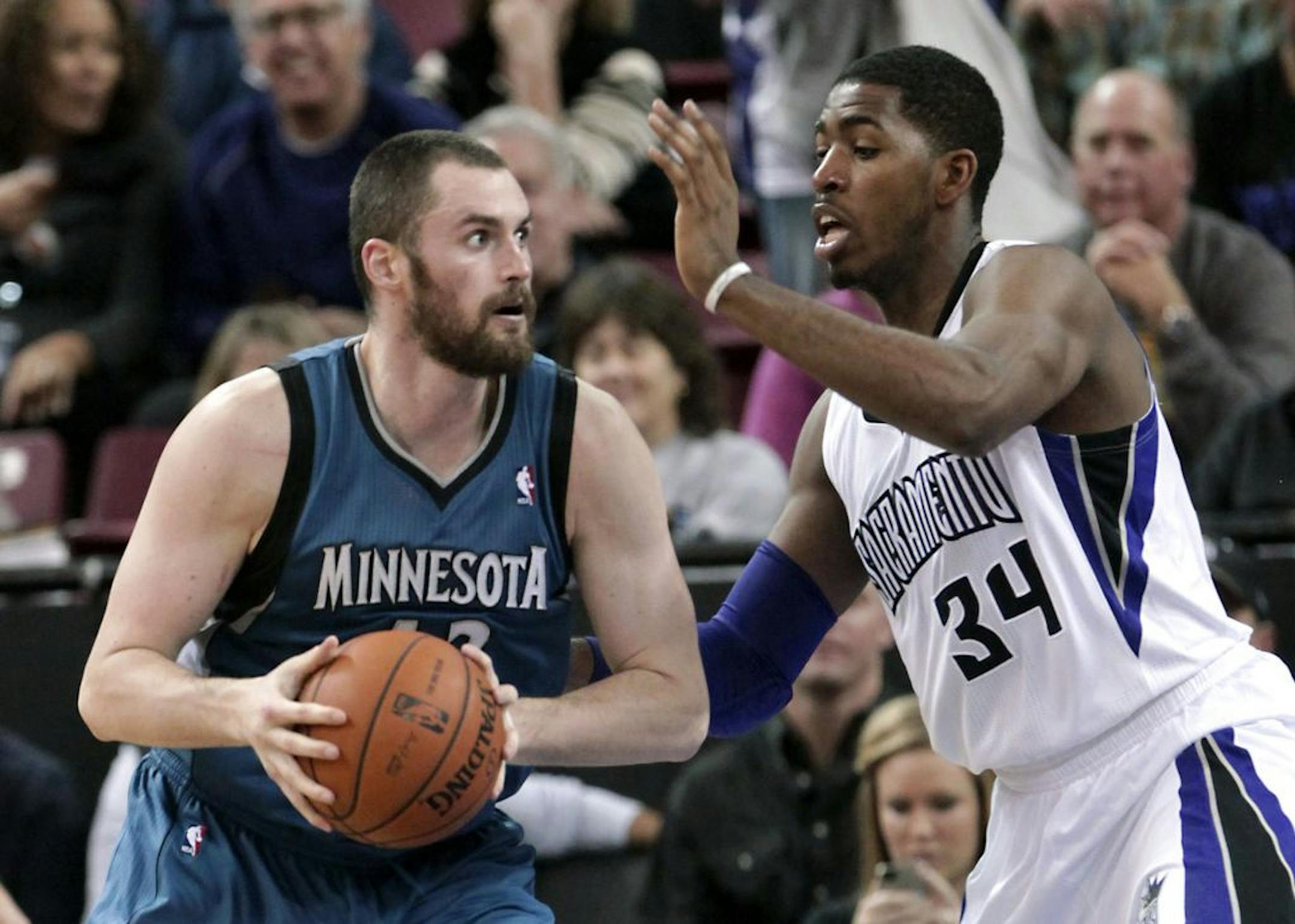 Timberwolves forward Kevin Love, left.