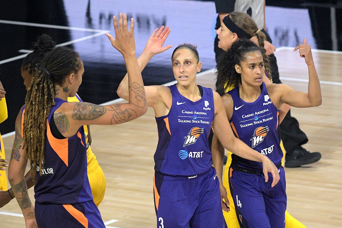 Phoenix Mercury guard Diana Taurasi (3) is congratulated by center Brittney Griner, left, and Skylar Diggins-Smith (4) after scoring a basket during the first half of a WNBA basketball game against the Los Angeles Sparks, Saturday, July 25, 2020, in Ellenton, Fla. (AP Photo/Phelan M. Ebenhack)