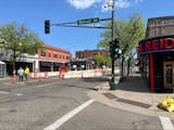 Crews stand along West Seventh Street in St. Paul, where a sinkhole opened. Construction could shut down regular traffic to the area for months.