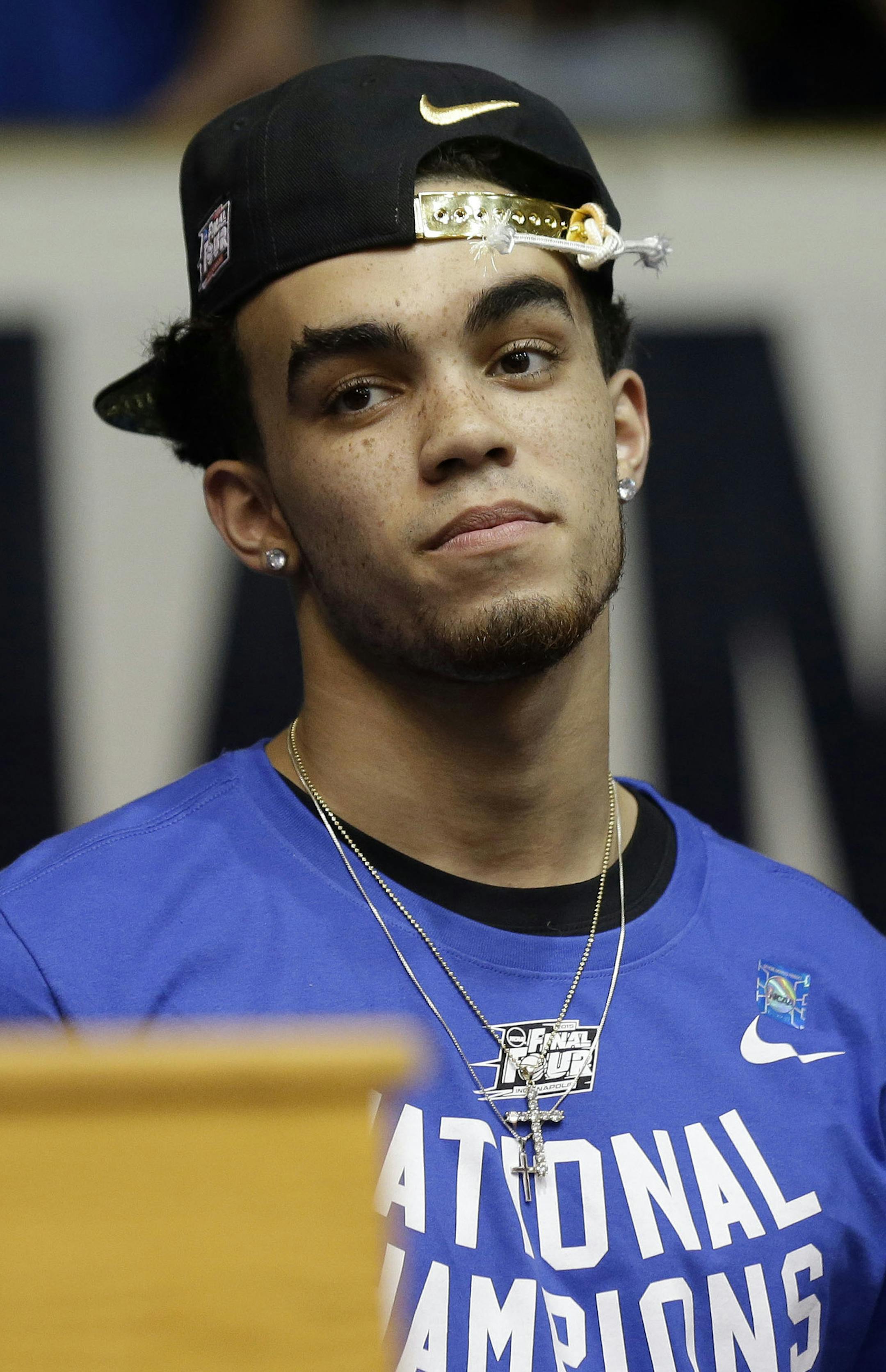 Duke's Tyus Jones watches as he and members of the Duke national championship basketball team are welcomed at a homecoming celebration at Cameron Indoor Stadium Tuesday, April 7, 2015 in Durham, N.C. Duke defeated Wisconsin Monday night in the NCAA Final Four tournament championship game. (AP Photo/Gerry Broome)