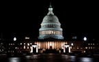 The U.S. Capitol at night just ahead of the start of the partial shutdown of the federal government, which began as of midnight ET Friday.