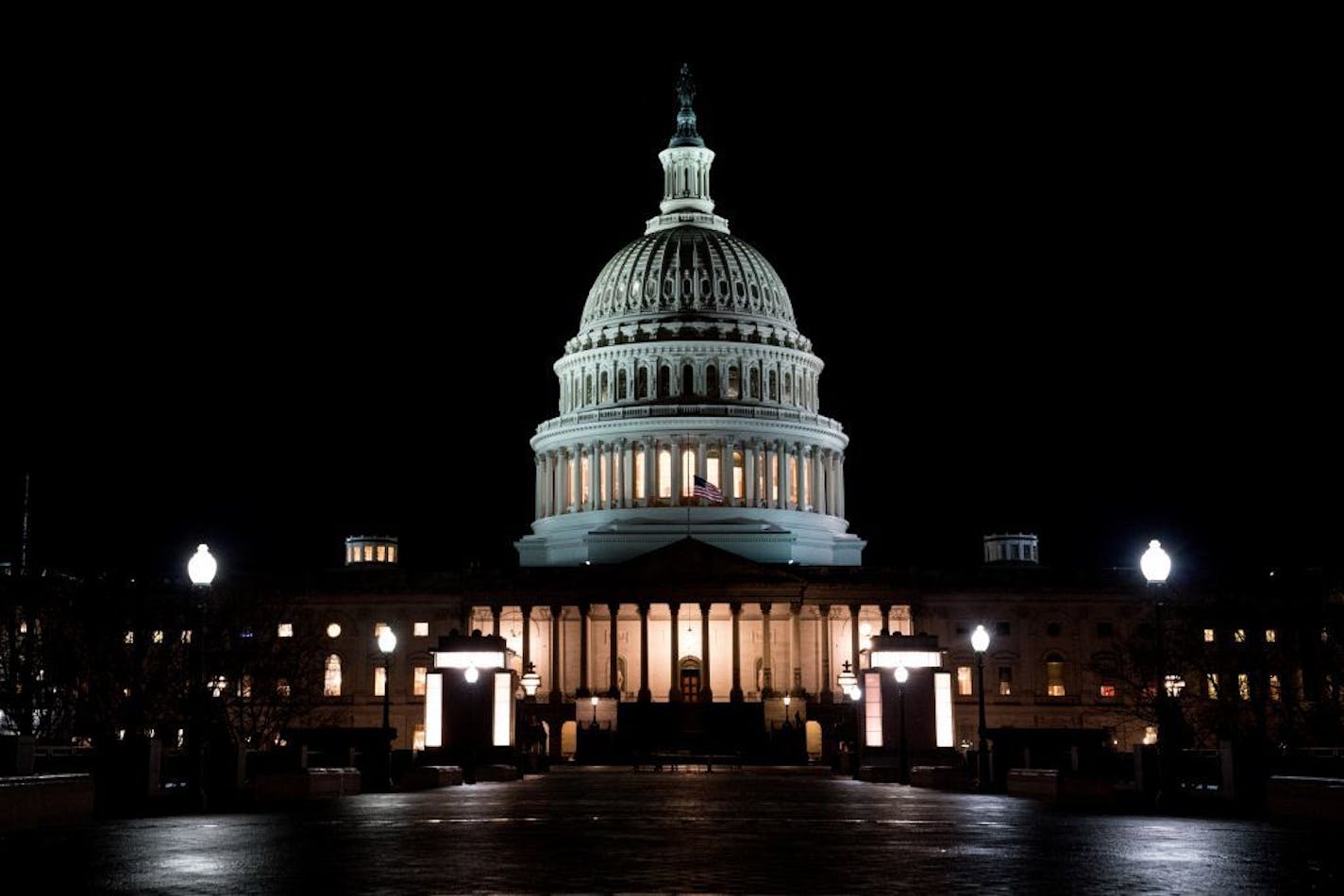 The U.S. Capitol at night just ahead of the start of the partial shutdown of the federal government, which began as of midnight ET Friday.