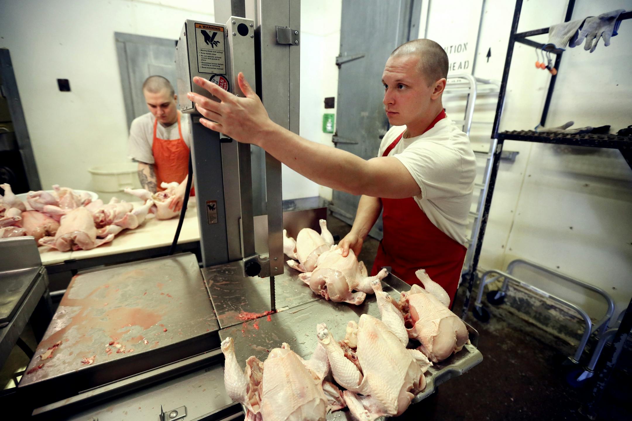 Shawn Wirta right and Zach Malich inmates at the Northeast Regional Corrections Center butchered chickens. Inmates at the Northeast Regional Corrections Center butcher chickens and pigs mostly to eat later in the week for lunch. A few lawmakers want to turn that loose program into a certification-granting curriculum with the idea that it will help the men get jobs and, more broadly, respond to a shortage of butchers.