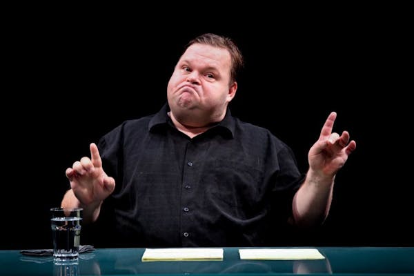 Mike Daisey during a scene from the one-man show "The Agony and the Ecstasy of Steve Jobs" at the Public Theater in New York, Oct. 9, 2011.