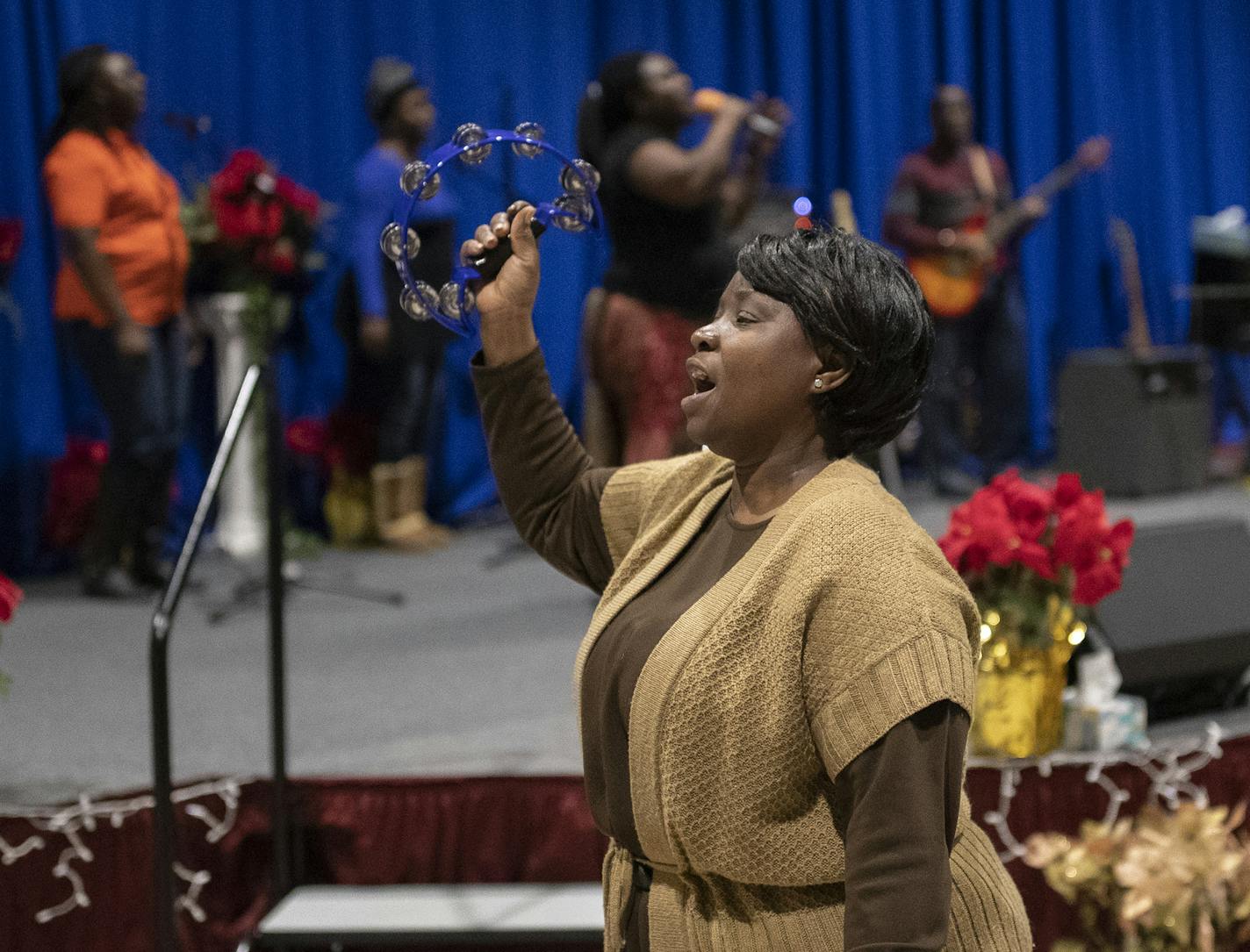 Christine Tabla of ,Brooklyn Park shook the tambourine as the congregation at Ebenezer Community Church thanked God for the Senates amendment that gives recipients of DED status permanent residency and a path to citizenship .] Jerry Holt &#x2022; Jerry.Holt@startribune.com Liberians react to the Senate passage of a defense bill that includes an amendment that gives recipients of DED status permanent residency and a path to citizenship, ending decades of uncertainty during prayer service Ebenezer