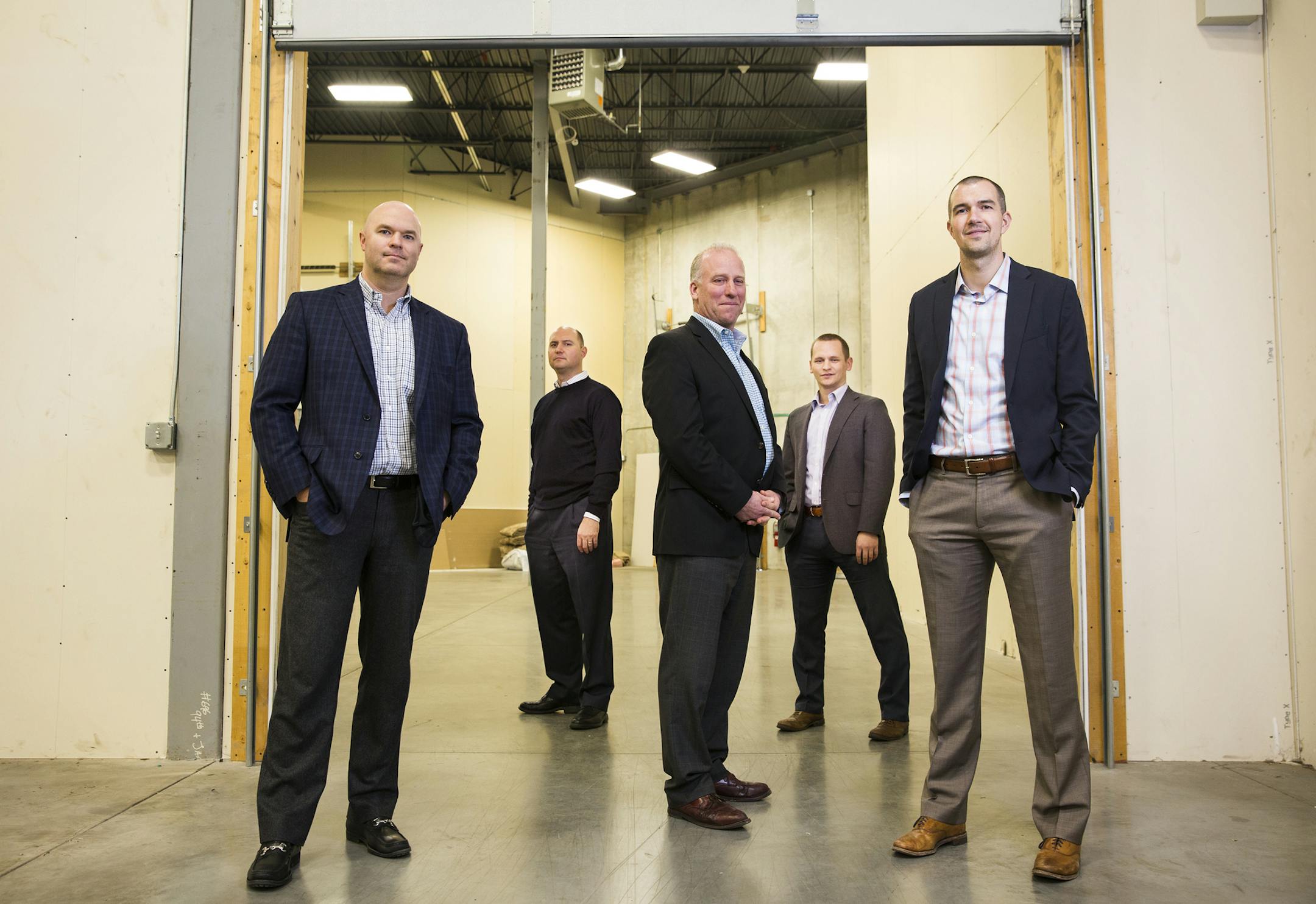 At Cushman & Wakefield/NorthMarq, Kris Smeltzer, left, Jason Meyer, Jon Yanta, Hudson Brothen and Brent Masica make up the industrial warehouse real estate team that is a long-running success.