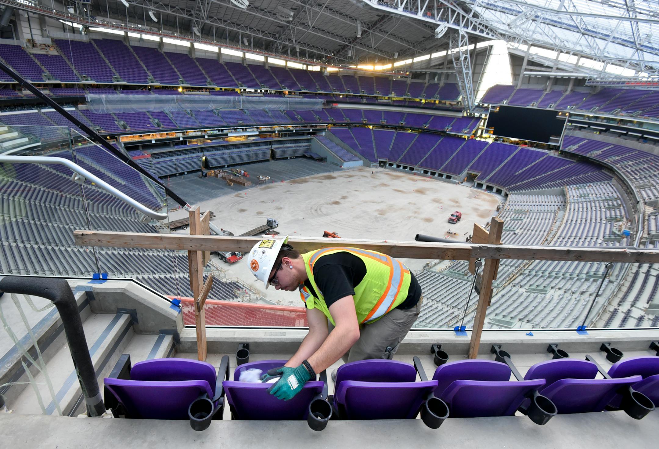 Workers install two rows of seats in section 349 of U.S. Bank Stadium, the new home of the Minnesota Vikings, in Minneapolis, Minn. on Friday March 25, 2016. (Richard Marshall for the Minnesota Vikings)