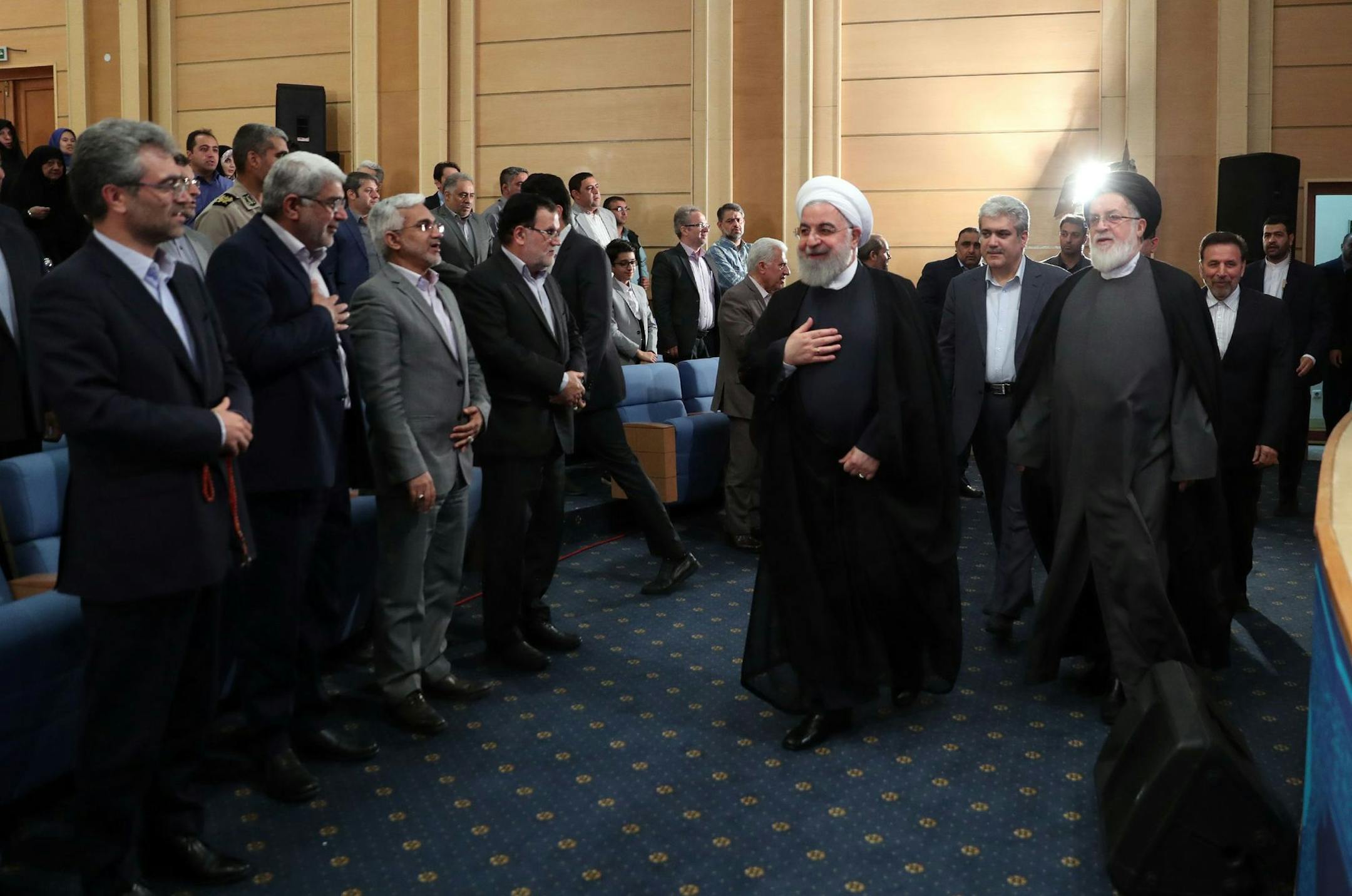 FILE-- In a photo provided by the Office of the Iranian Presidency, President Hassan Rouhani of Iran during a ceremony in Tehran, Iran, May 23, 2019. Tensions between the U.S. and Iran flared on June 18, 2019, as Tehran said it would soon breach a key element of the 2015 international pact limiting its nuclear program, while President Donald Trump ordered another 1,000 troops to the Middle East and vowed again that Iran would not be allowed to develop a nuclear weapon. (Office of the Iranian Pre