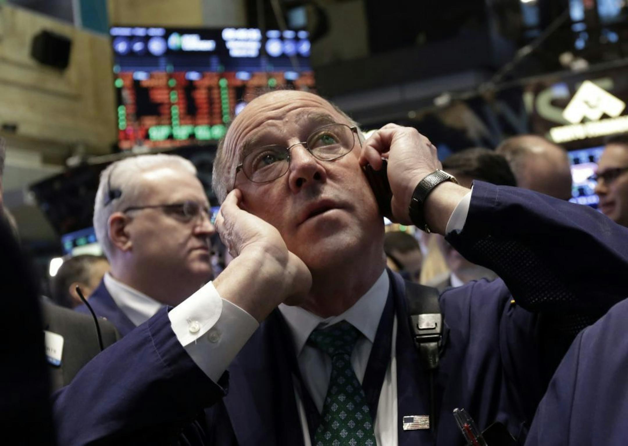 Trader Frederick Reimer works on the floor of the New York Stock Exchange, Wednesday, March 26, 2014. The stock market opened higher Wednesday after a strong report on American manufacturing. The maker of the hit game "Candy Crush Saga" flopped in its market debut.