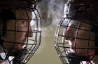 (Left) University of Minnesota Duluth defensemen Nick Wolff and Scott Perunovich posed for a portrait on the ice of Amsoil Arena on Tuesday. ]
ALEX KO