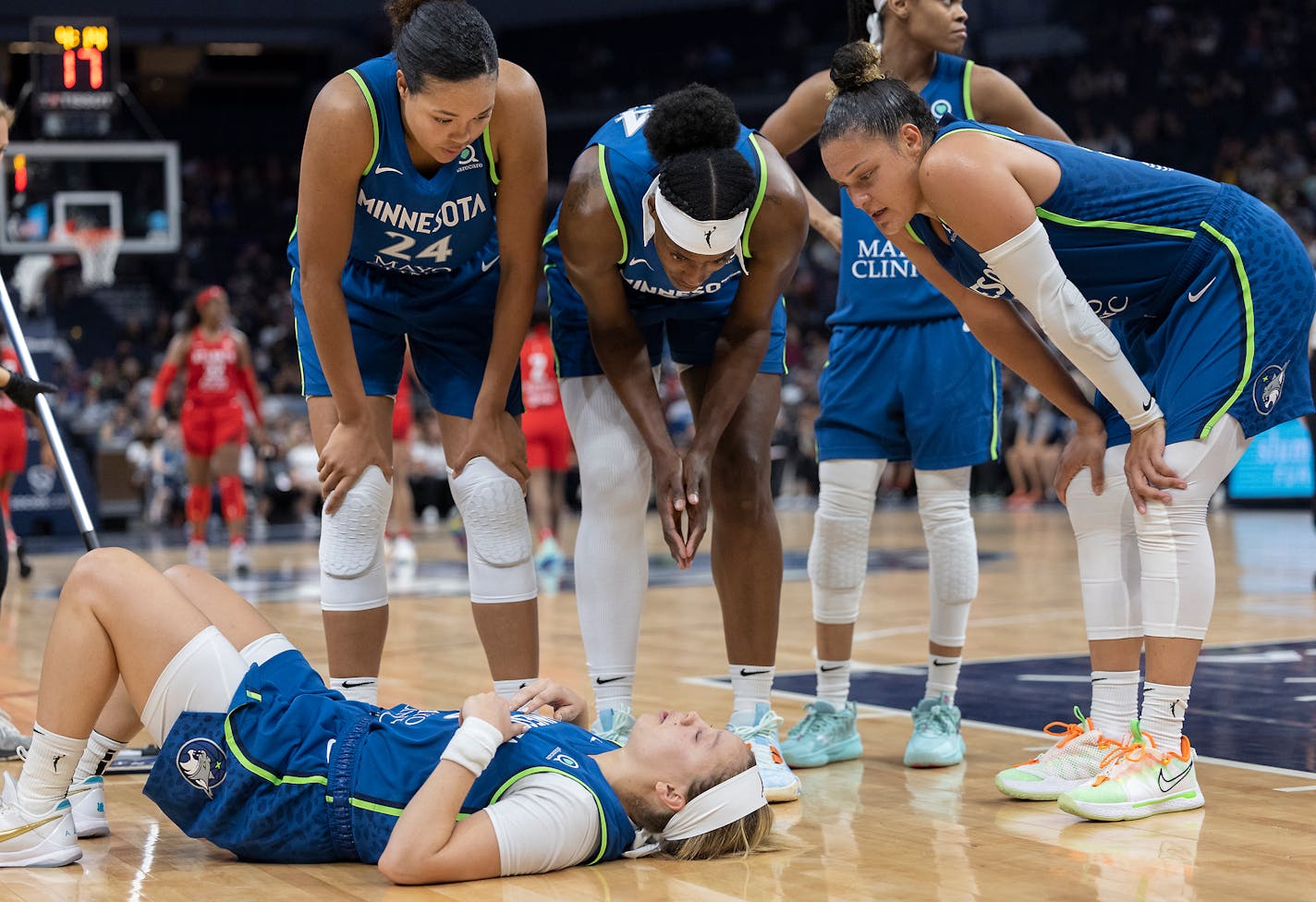 Minnesota Lynx players look after Minnesota Lynx guard Rachel Banham (15) after she fell during the fourth quarter at the Target Center, in Minneapolis, Minn., on Sunday, August 7, 2022. ] Elizabeth Flores • liz.flores@startribune.com