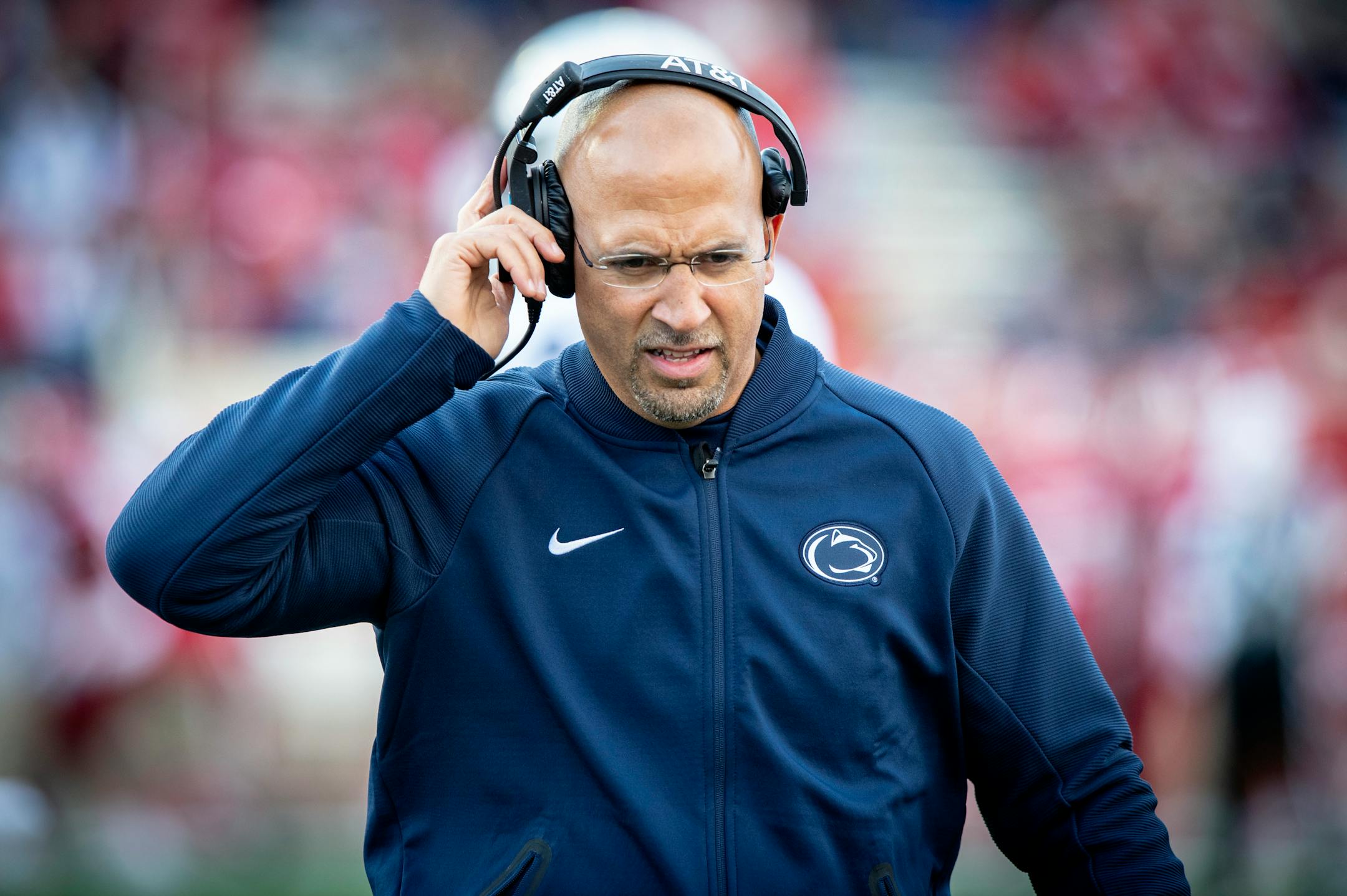 Penn State head coach James Franklin listens to his headphone during the second half of an NCAA college football game Saturday, Oct. 20, 2018, in Bloomington, Ind. Penn State won 33-28. (AP Photo/Doug McSchooler)