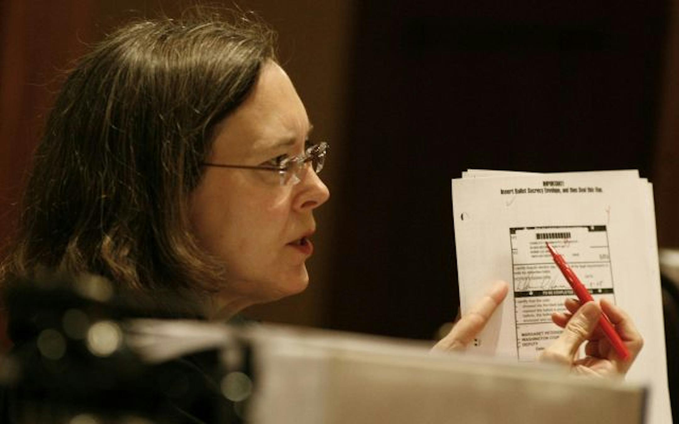 Judge Denise Reilly asked a question about initials on a ballot during testimony Wednesday by Washington County elections manager Kevin Corbid in the Senate recount trial between DFLer Al Franken and Republican Norm Coleman. Top photo: David Lillehaug, attorney for Franken, emphasized Minnesota rules on absentee ballots during his cross-examination in the St. Paul courtroom.