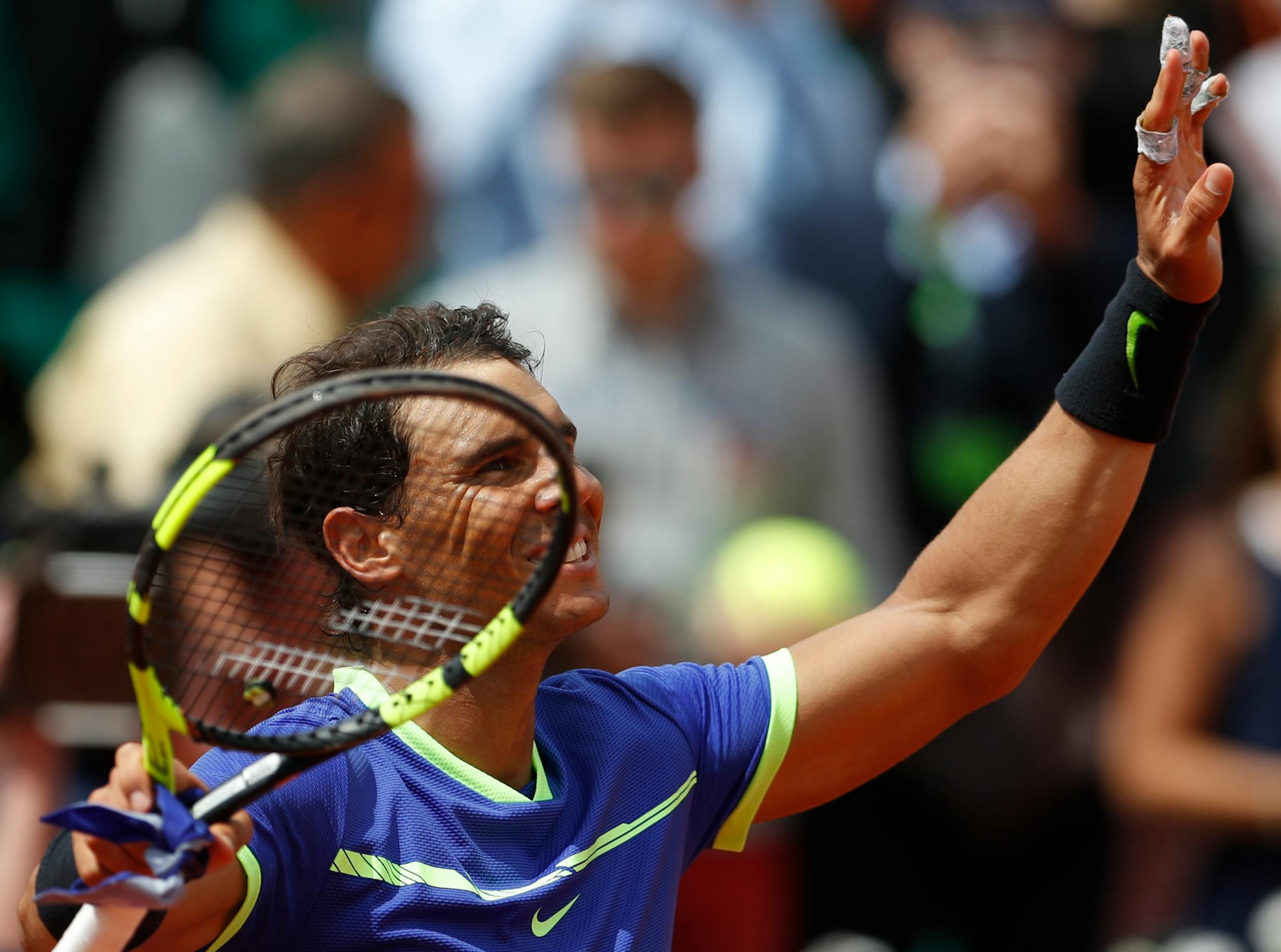 Spain's Rafael Nadal waves after defeating compatriot Roberto Bautista Agut during their fourth-round match of the French Open on Sunday. Nadal won 6-1, 6-2, 6-2.