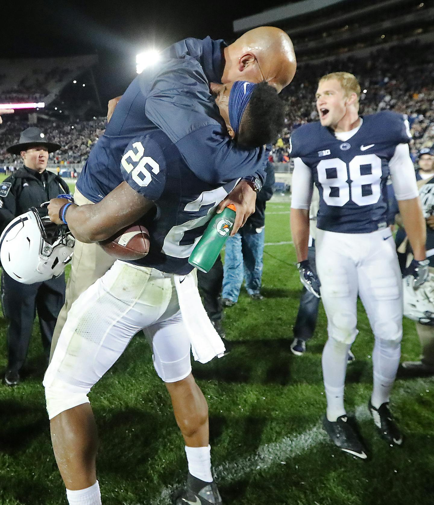 Penn State's head coach James Franklin gave running back Saquon Barkley a big hug after he scored the winning touchdown beating Minnesota 29-23 in overtime at Beaver Stadium, Saturday, October 1, 2016 in State College, PA. ] (ELIZABETH FLORES/STAR TRIBUNE) ELIZABETH FLORES &#x2022; eflores@startribune.com