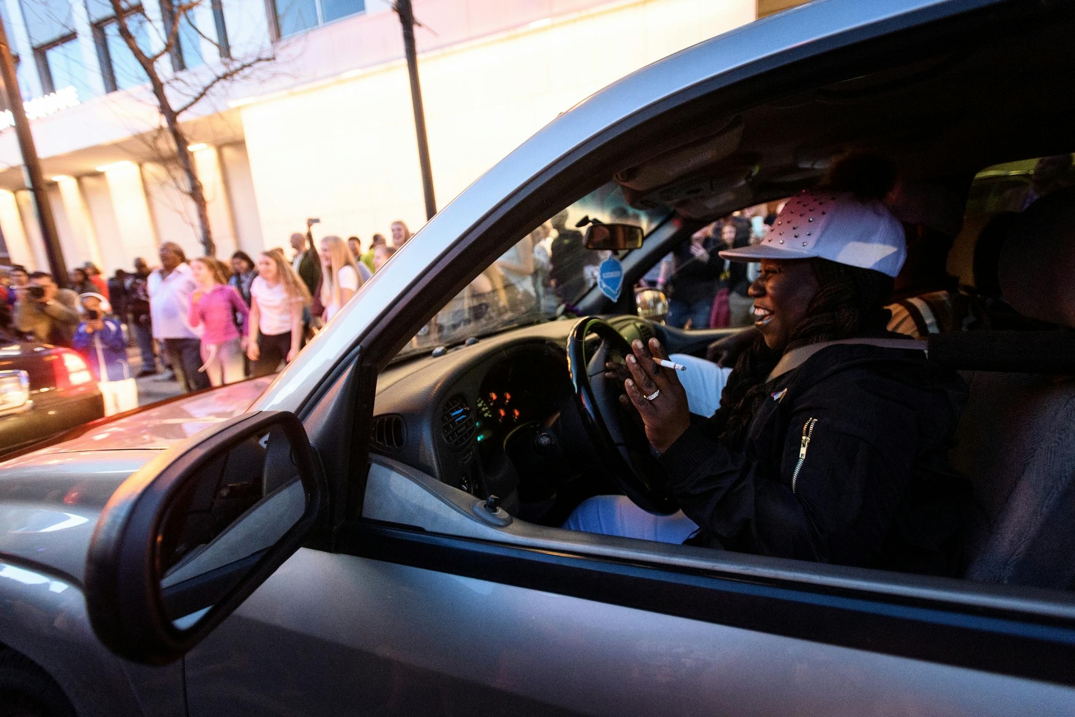 A motorist could do nothing but laugh as traffic was blocked by Prince revelers in 7th Street downtown.