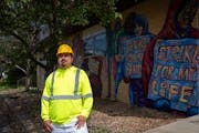 Douglas Guerra, who has organized protest marches on construction job sites for CTUL members, stands for a portrait outside the nonprofit workers’ r