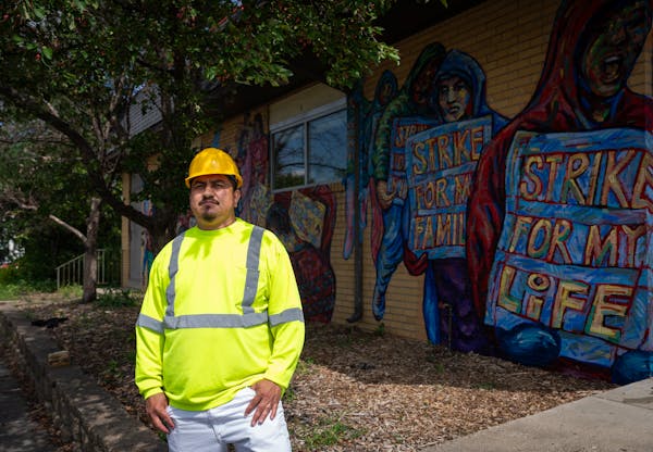 Douglas Guerra, who has organized protest marches on construction job sites for CTUL members, stands for a portrait outside the nonprofit workers’ r