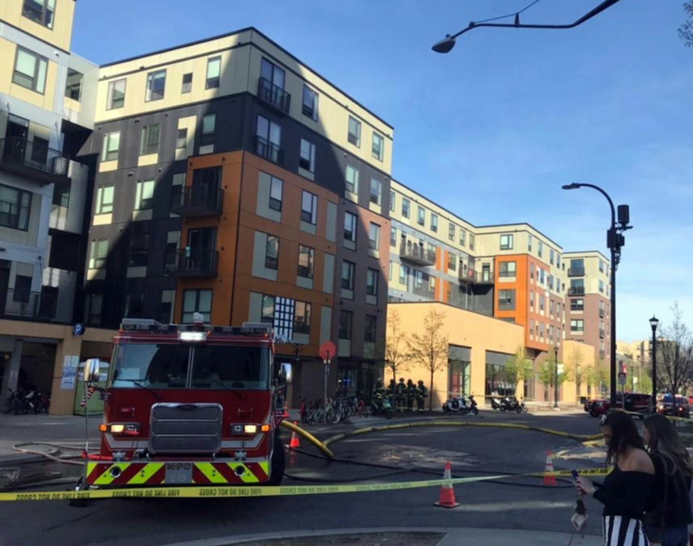 Firefighters enter the building after residents were evacuated.