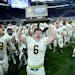 Totino Grace fullback Brady Bertram ( 6) celebrated with his team's 6A championship victory after defeating Eden Prairie Friday night.