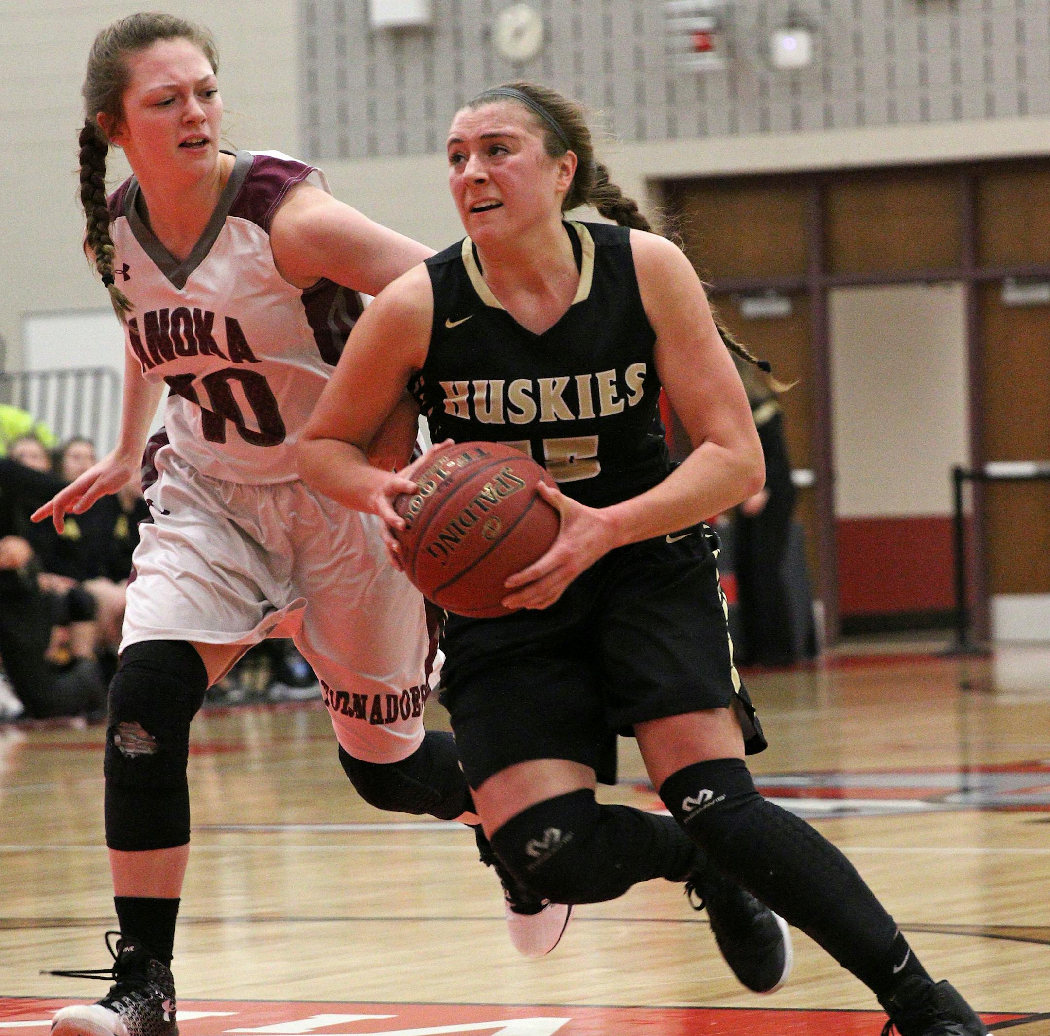 Jolene Daninger (15) drives the lane for the Huskies. Daninger lead Andover in scoring with 13 points in a 46-45 win over Anoka Wednesday at North Branch High School. Photo by Cheryl Myers, SportsEngine