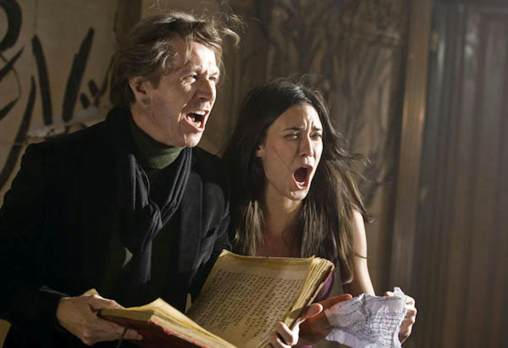 Rabbi Sendak (GARY OLDMAN) and Casey Beldon (ODETTE YUSTMAN) attempt an exorcism in a supernatural thriller that tells the story of a young woman pulled into a world of nightmares when a demonic spirit haunts her and threatens everyone she loves--"The Unborn."