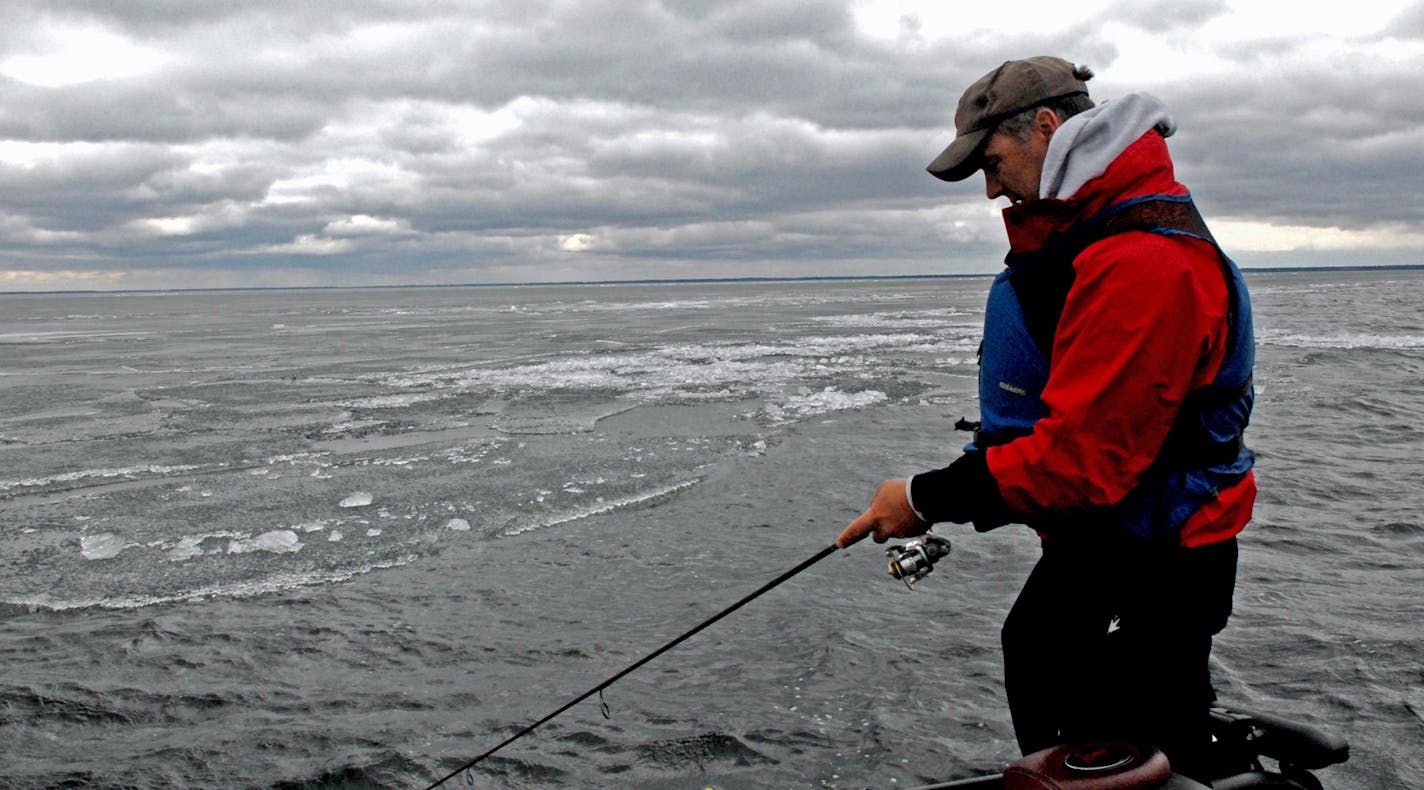 John Heroff of Stillwater tried his luck for walleyes, following the edge of a massive sheet of ice that still covered most of Lake Winnibigoshish on opening day last May. ORG XMIT: MIN1305111154110859 ORG XMIT: MIN1312231233403464