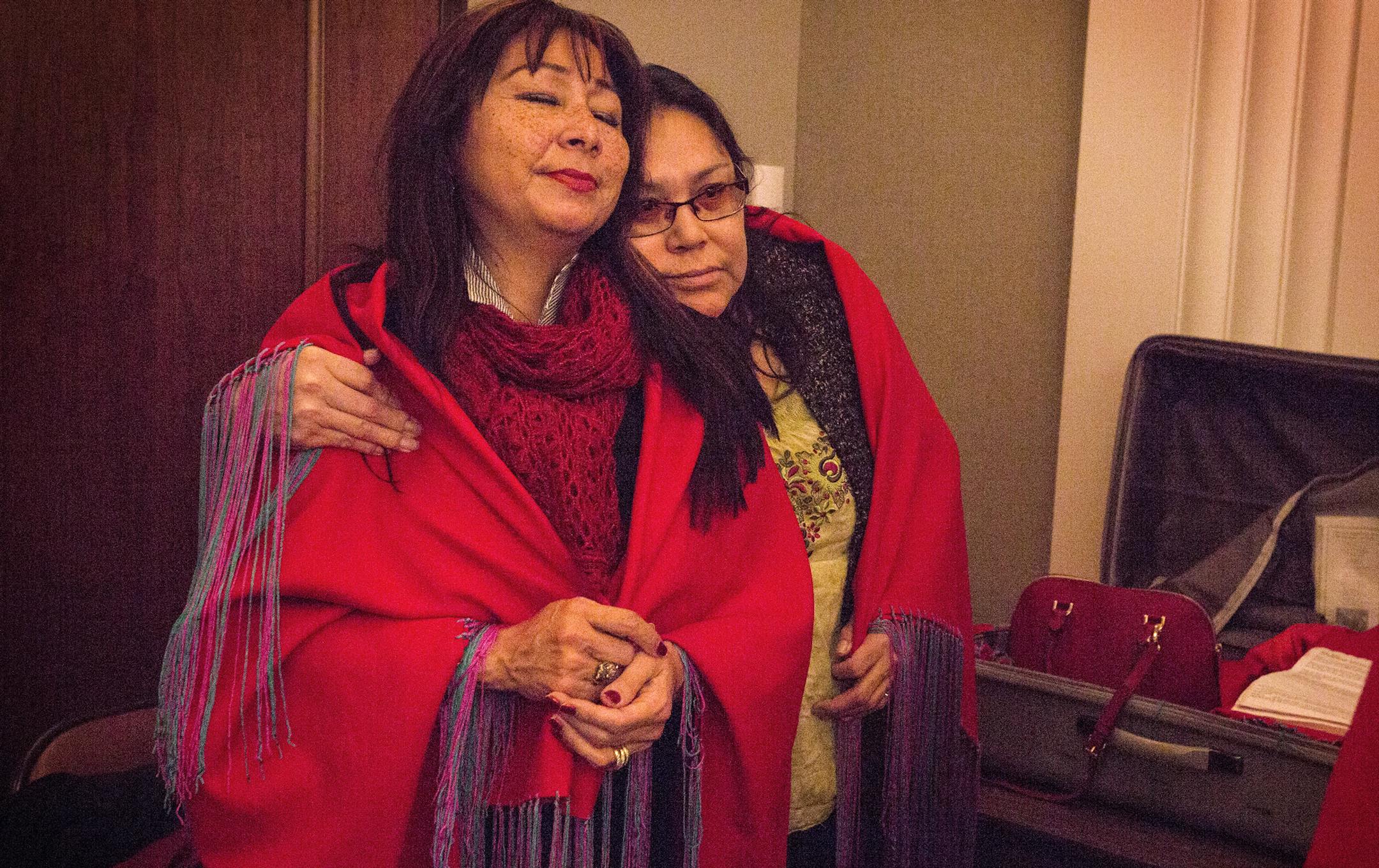 Debra Poitra of the Minnesota Indian Women's Sexual Assault Coalition (MIWSAC) gets a hug from Victoria Fineday who works at the women's shelter Equaywiigamig in Red Lake during a press conference held by the Minnesota Coalition for Battered Women at the State Office Building in St. Paul on Tuesday, January 26, 2016. ] (Leila Navidi/Star Tribune) leila.navidi@startribune.com BACKGROUND INFORMATION: The Minnesota Coalition for Battered Women released the "Femicide Report." The report includes an