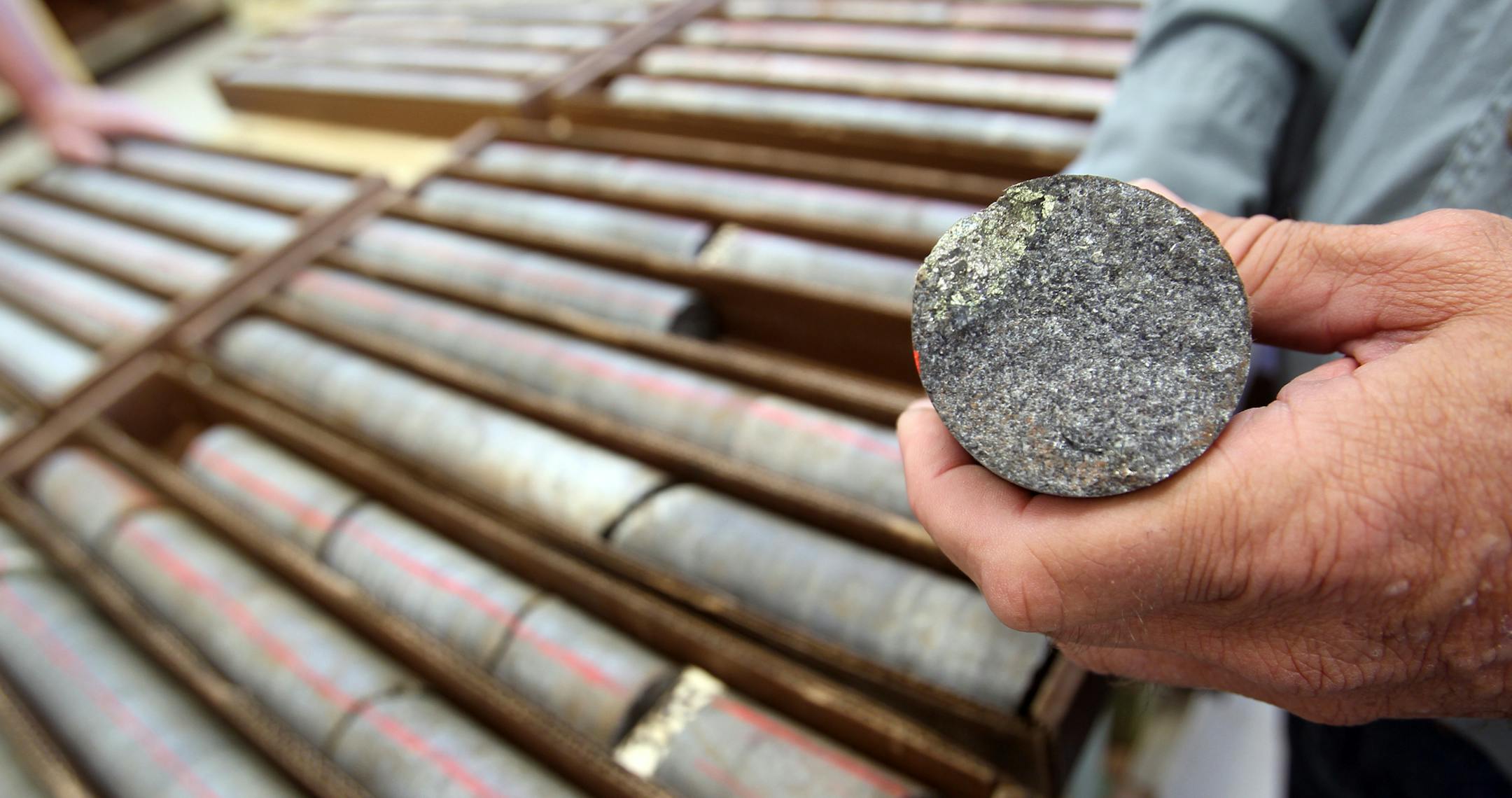 David Oliver, manager of special projects, held a sample that had metal speckles that he had taken from one of many of the boxes of core samples lined tables at Twin Metals in Ely, Minn., Wednesday, September 7, 2011. The company collects 1000 ft. a day of these earth samples to determine the richness of copper, nickel and other precious metals. ] (RENEE JONES SCHNEIDER/ reneejones@startribune.com) David Oliver CQ ORG XMIT: MIN2016031615453653