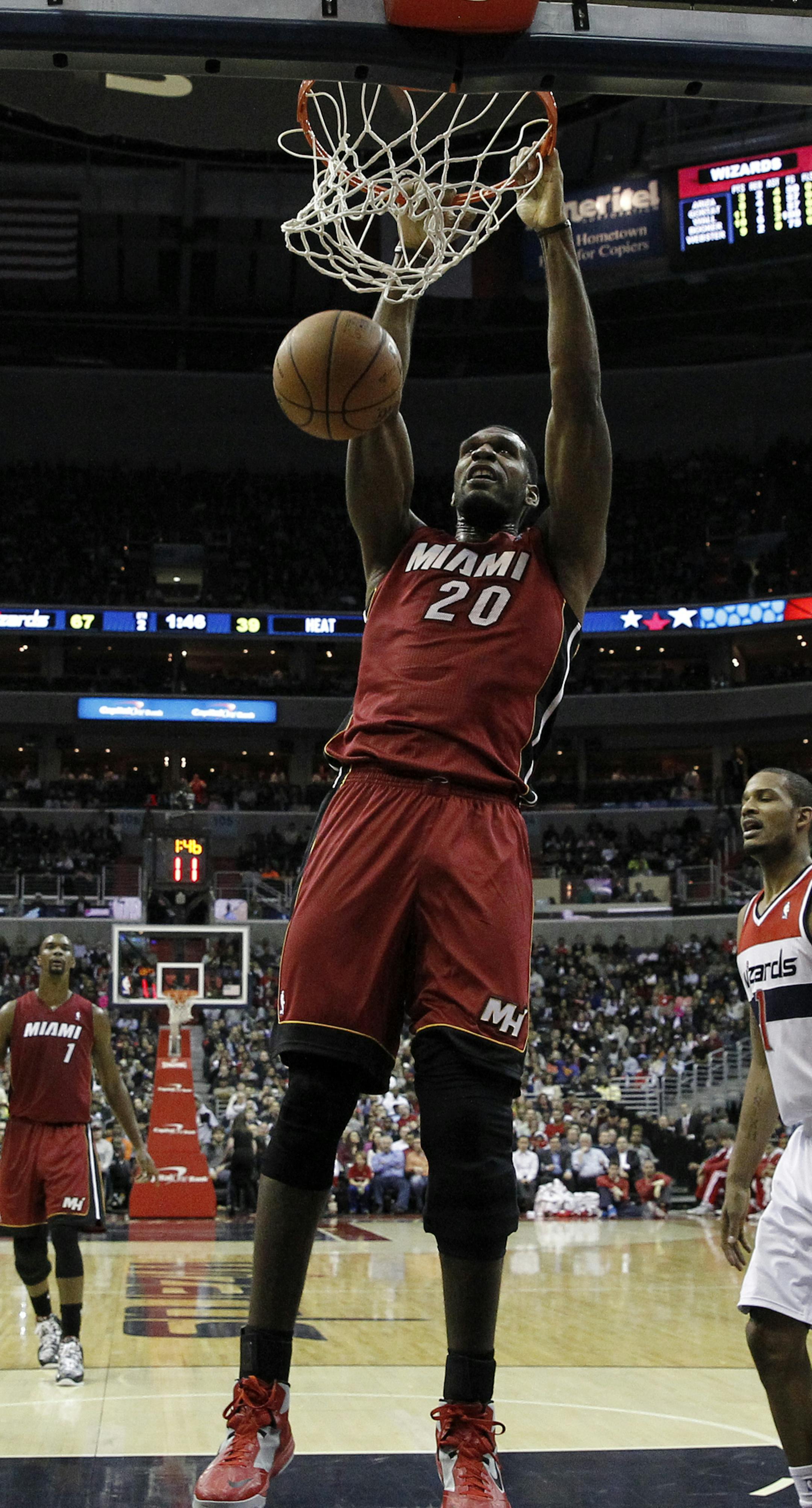Miami Heat center Greg Oden (20) dunks the ball in the first half of an NBA basketball game against the Washington Wizards, Wednesday, Jan. 15, 2014, in Washington. (AP Photo/Alex Brandon) ORG XMIT: VZN10
