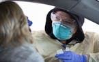 Cheryl Odegaard, a medical assistant at St. Luke's Respiratory Clinic, administered a COVID-19 test to a patient in their drive thru testing site on T