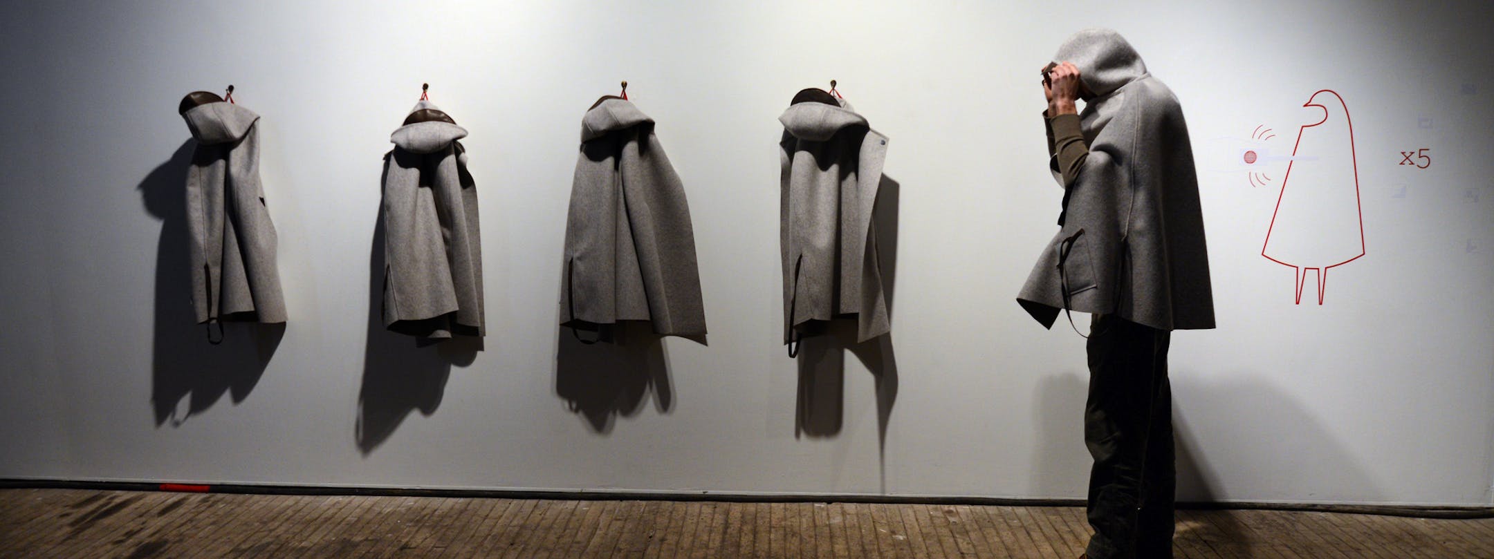 Emily Stover, General Delivery has a series of coats that have RFD tags that direct images of postcards that project messages that have been hand written by participants. ] Interactive art show by 5 local artists at the Soap factory. Richard.Sennott@startribune.com Richard Sennott/Star Tribune Minneapolis, Minn. Friday 3/14/2014) ** (cq)