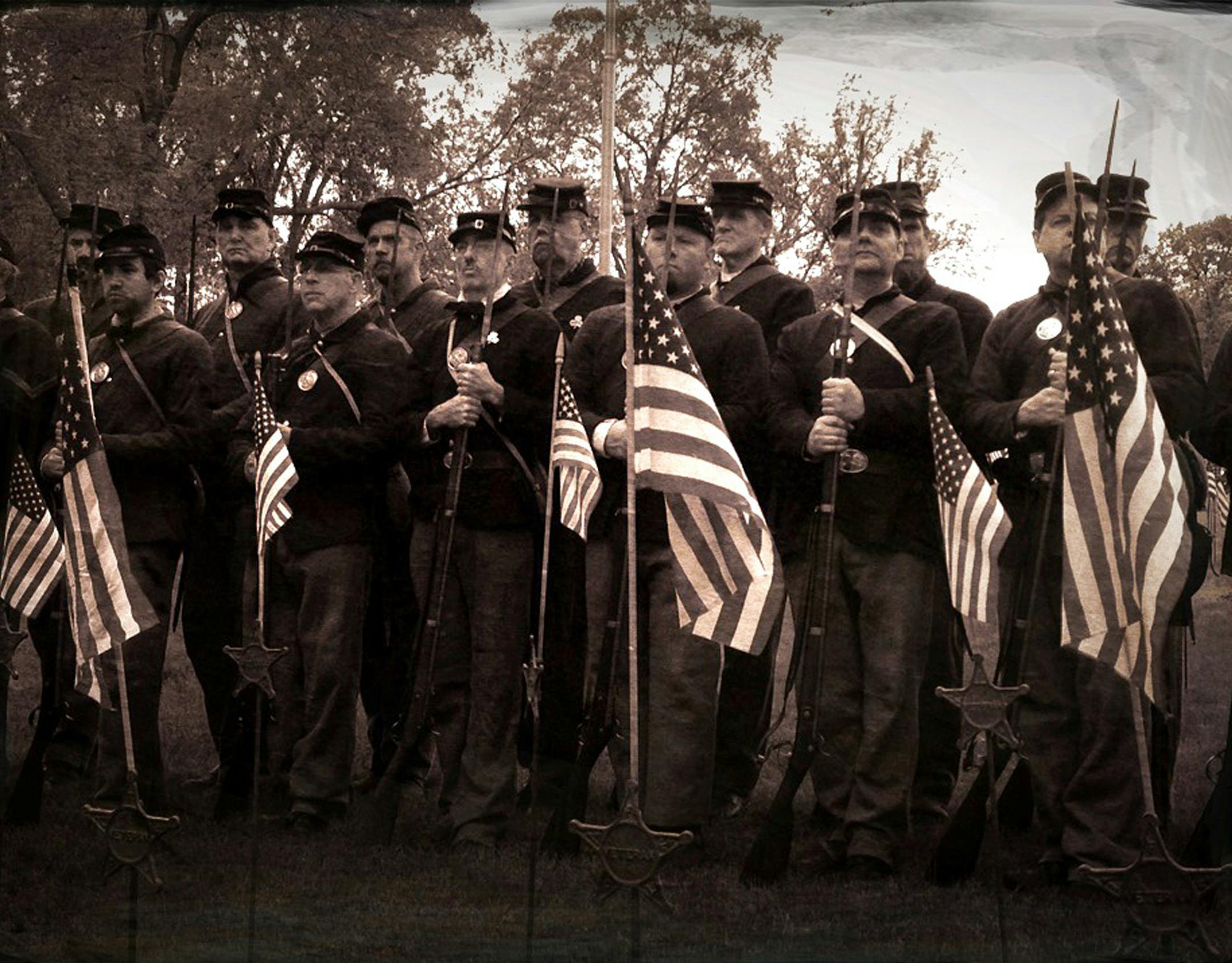 This year's Memorial Day service at Lakewood Cemetery paid honor to the 150th anniversary of the Civil War with Abraham Lincoln reenactor Kevin Koester reading the Gettysburg Address and the First and Second Minnesota Volunteer Infantries executing a rifle salute. This photo was taken using an iPhone and an app that recreates the look of a"tintype" photograph that was popular at the time. Monday, May 27, 2013 ] GLEN STUBBE * gstubbe@startribune.com ORG XMIT: MIN1305271420042787