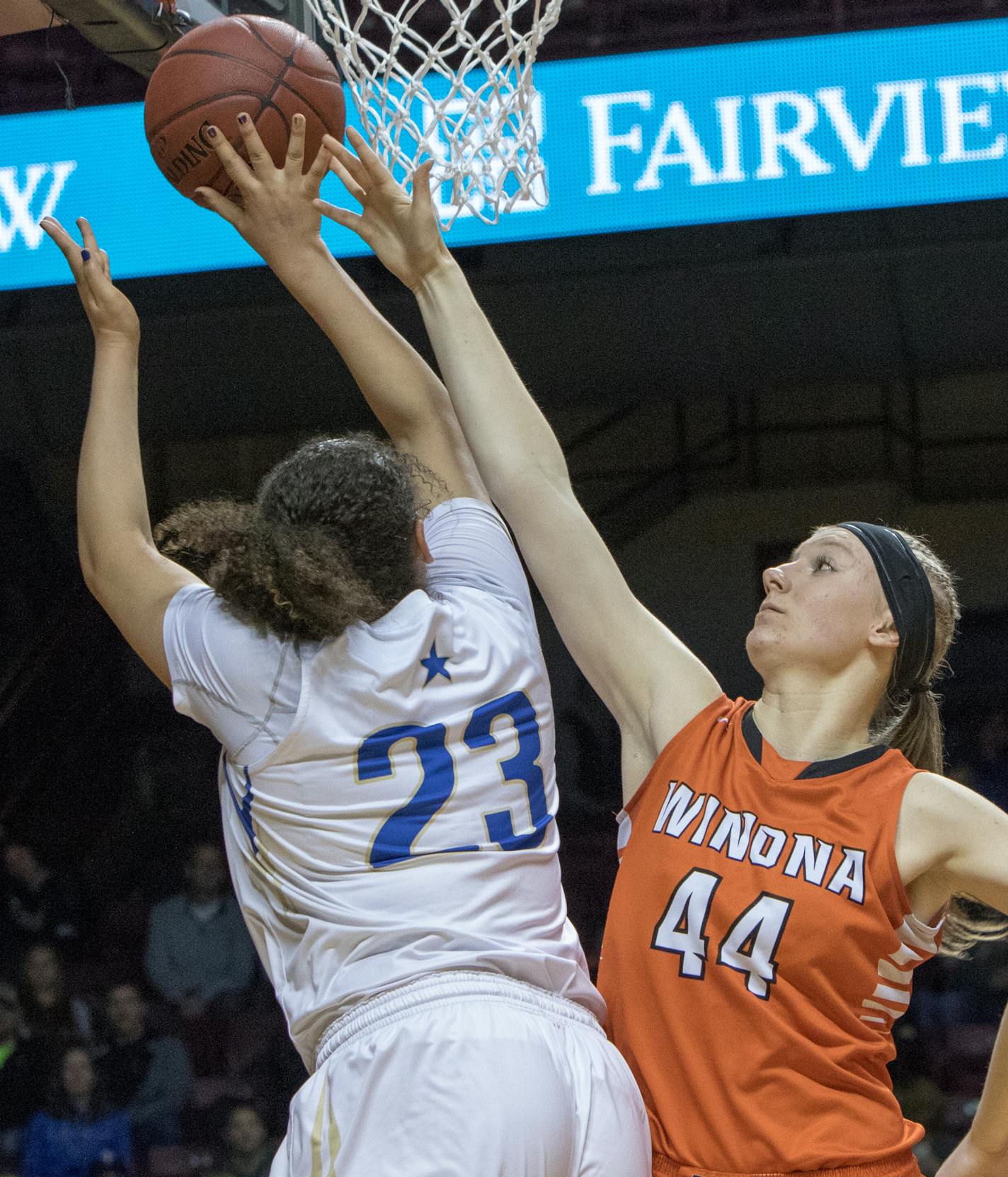 Winona center Danneka Voegeli (44) blocks Academy of Holy Angels forward Destinee Oberg (23) in the Class 3A Finals of the 2016 MSHSL Girls Basketball Tournament on March 19, 2016 at Williams Arena on the campus of University of Minnesota in Minneapolis, Minn. [ Special to Star Tribune, Matt Blewett | matt@mattebphoto.com, Matte B Photography, 2016 MSHSL Girls Basketball Tournament, Academy of Holy Angels, Winona High School, 41655 PREP032016