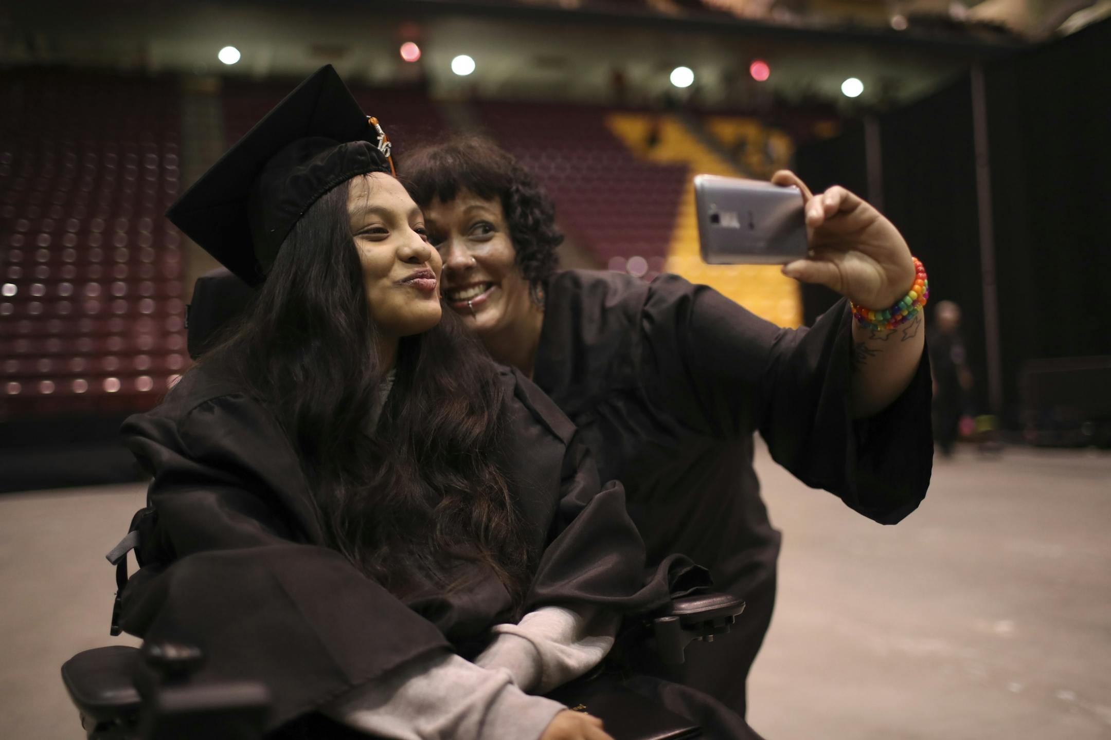 Guadalupe Galeno-Hernandez posed for a selfie with special eduction assistant Talitha Nelson after graduation Tuesday night.