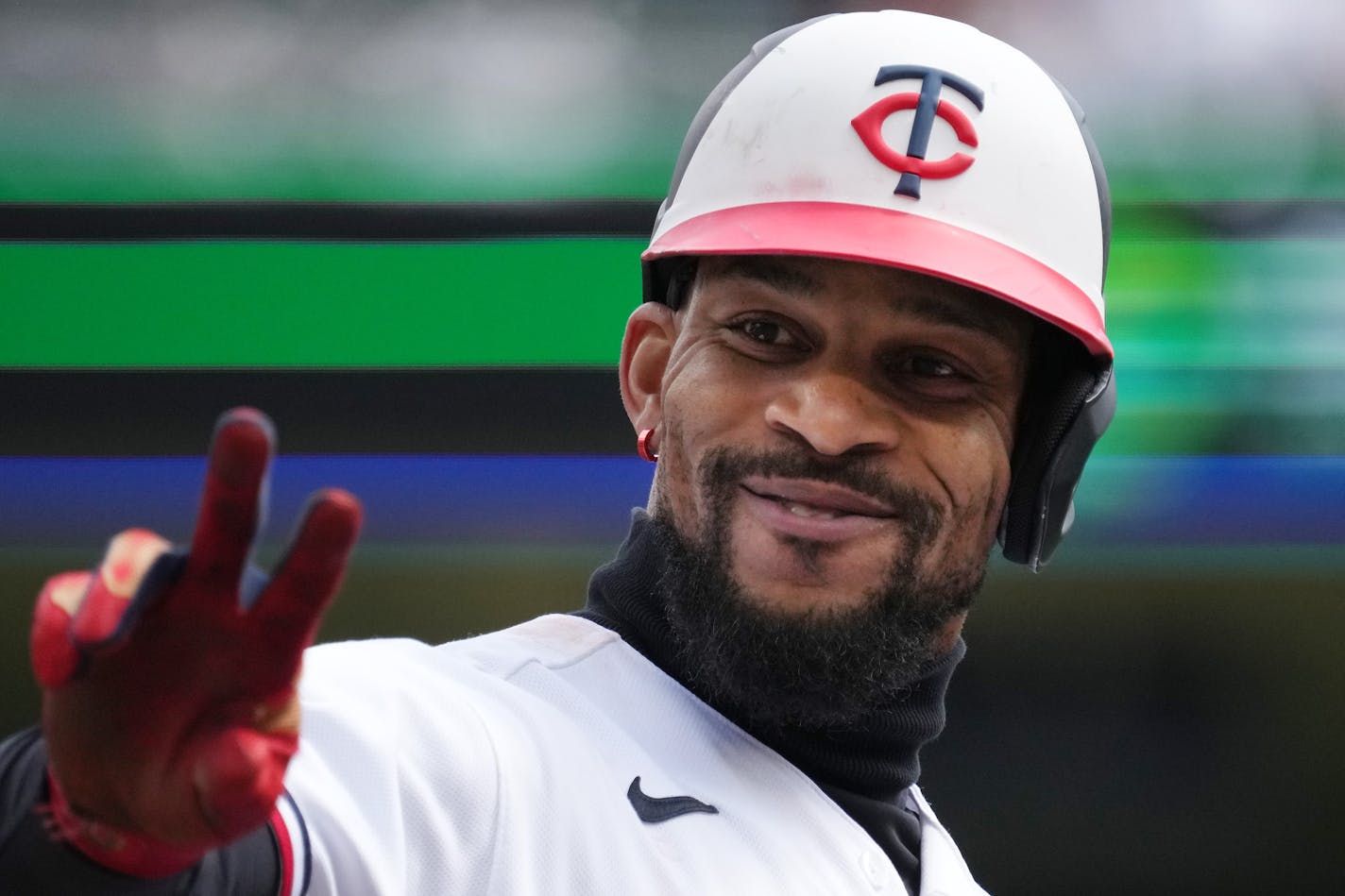 Minnesota Twins designated hitter Byron Buxton (25) smiles at the crowd after stealing third base on a wild pitch in the fourth inning of an MLB game between the Minnesota Twins and the Kansas City Royals Saturday, April 29, 2023, at Target Field in Minneapolis. ] ANTHONY SOUFFLE • anthony.souffle@startribune.com