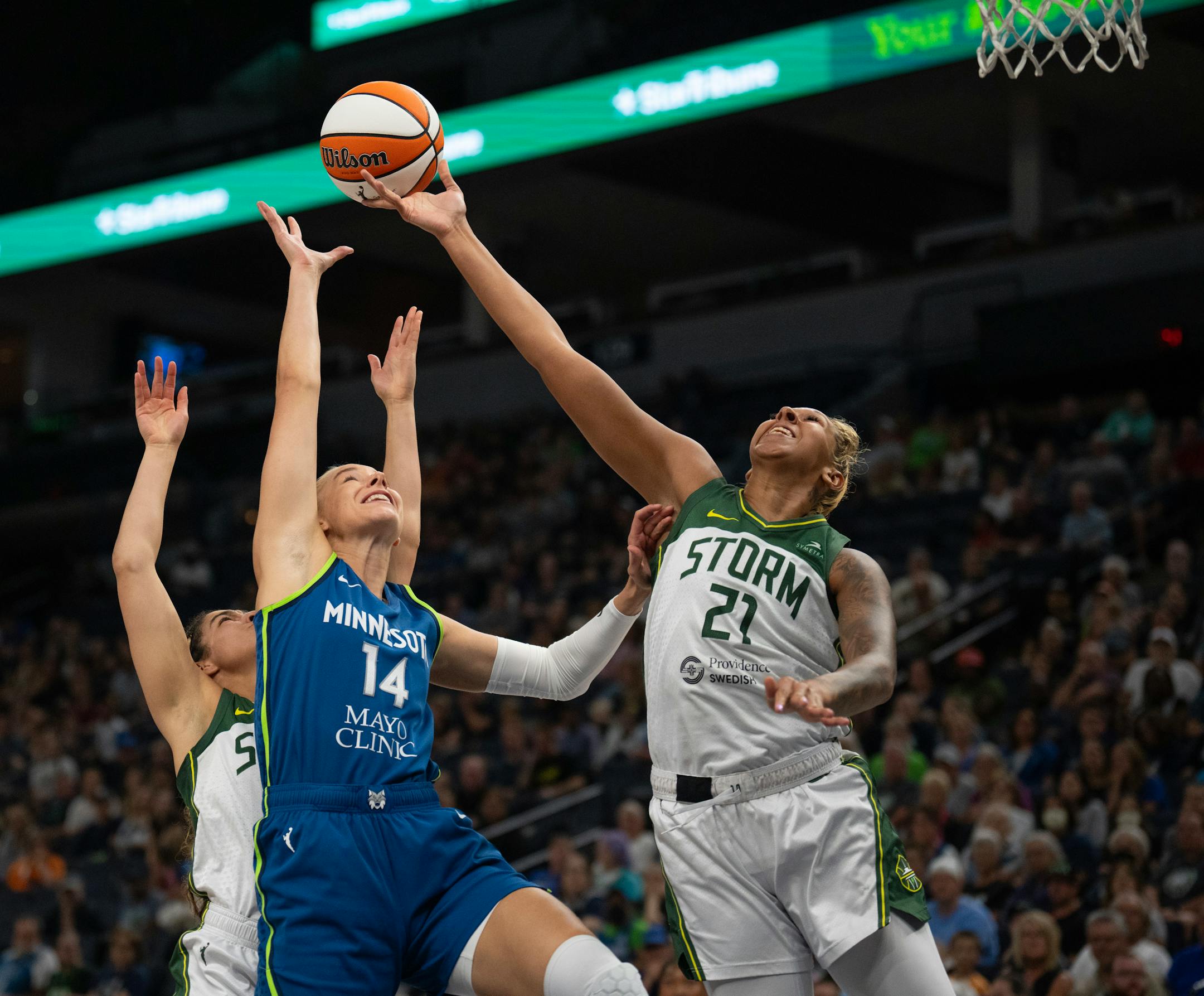 Seattle Storm center Mercedes Russell and Minnesota Lynx forward Dorka Juhasz vied for a rebound in the first quarter.