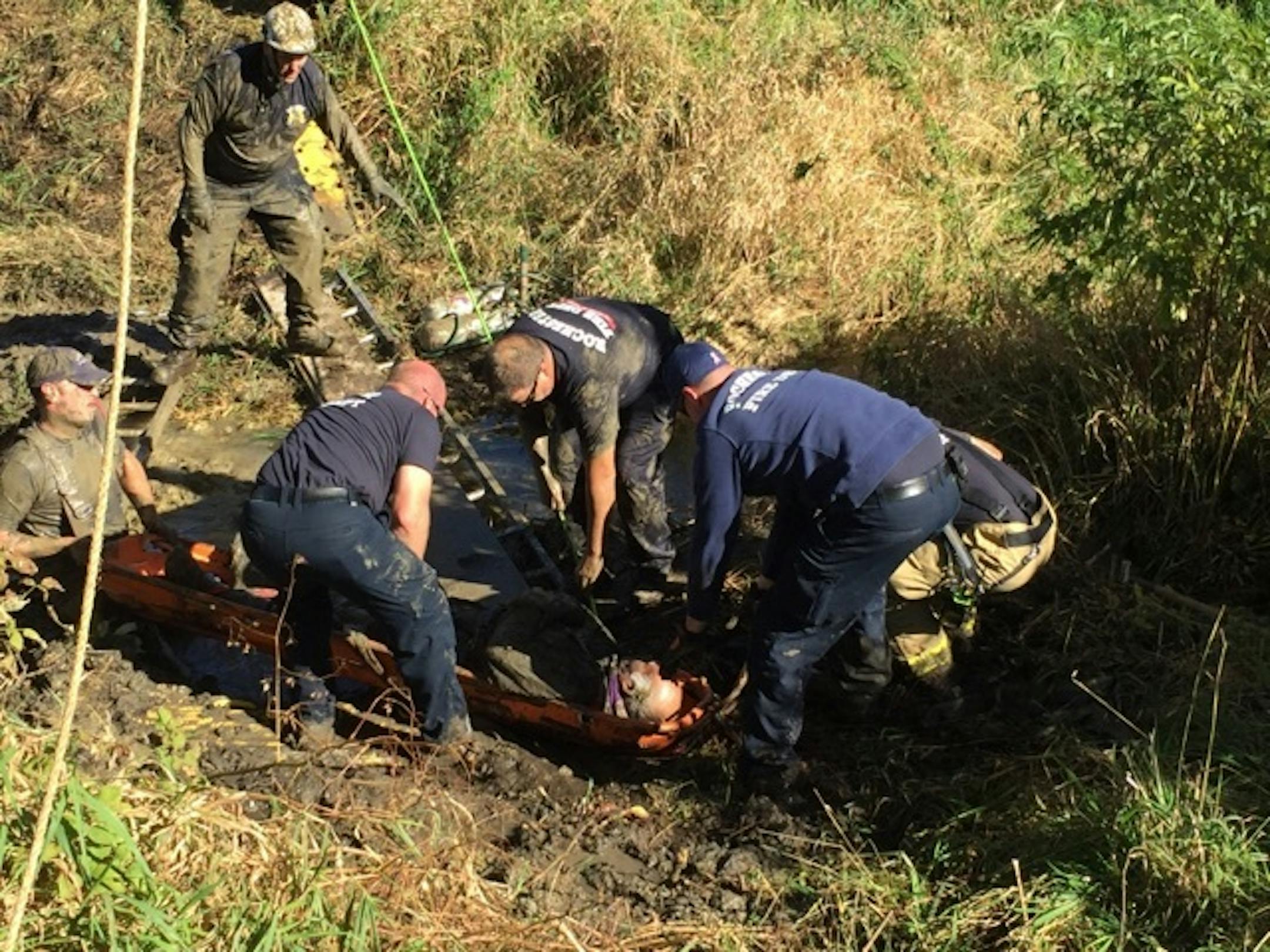 A worker stuck in mud up to his waist was freed by firefighters southeast of Rochester.