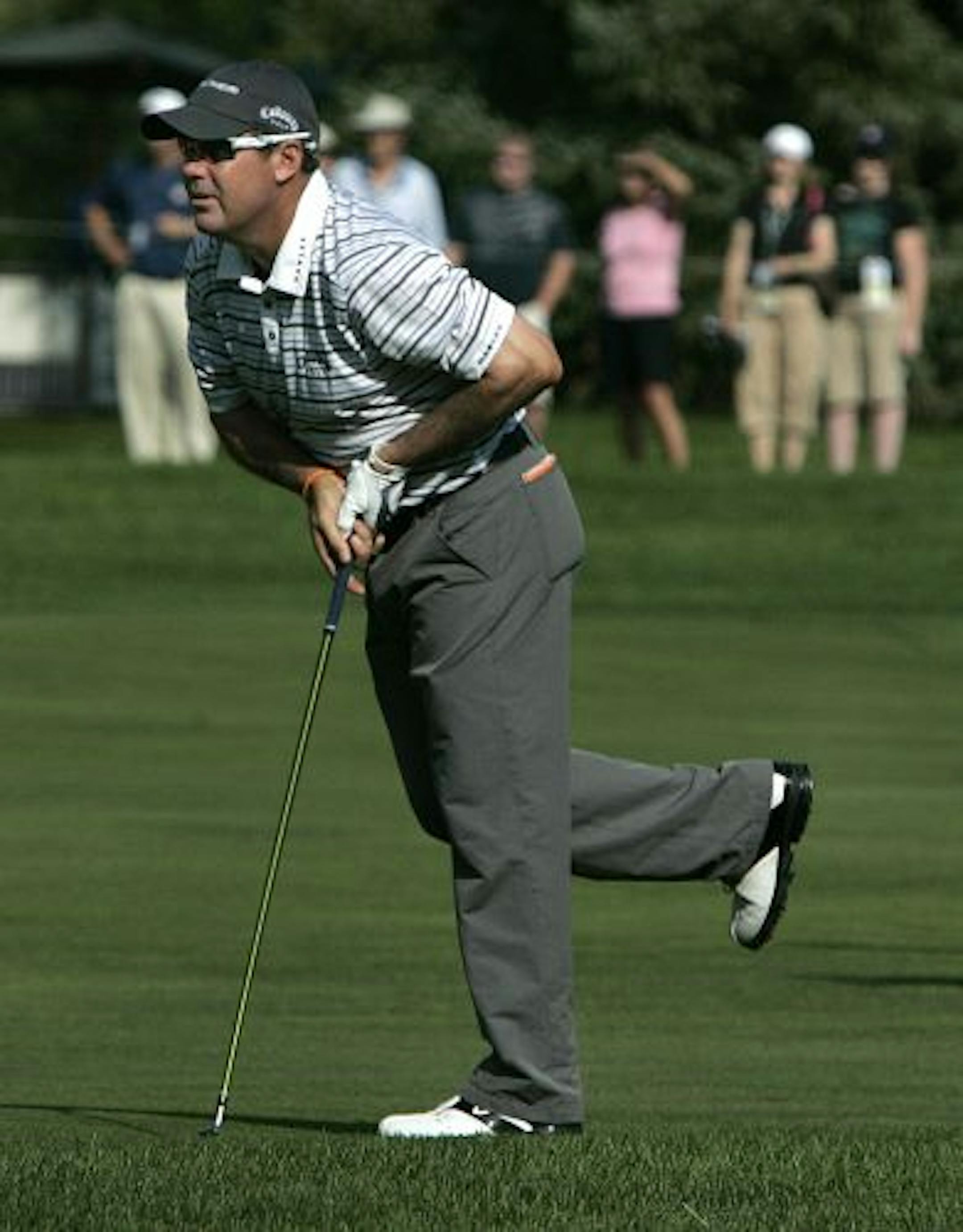 Rich Beem watched his approach shot fall short on the 13th hole on Thursday. The 2002 PGA winner is grouped with Tiger Woods and Padraig Harrington.