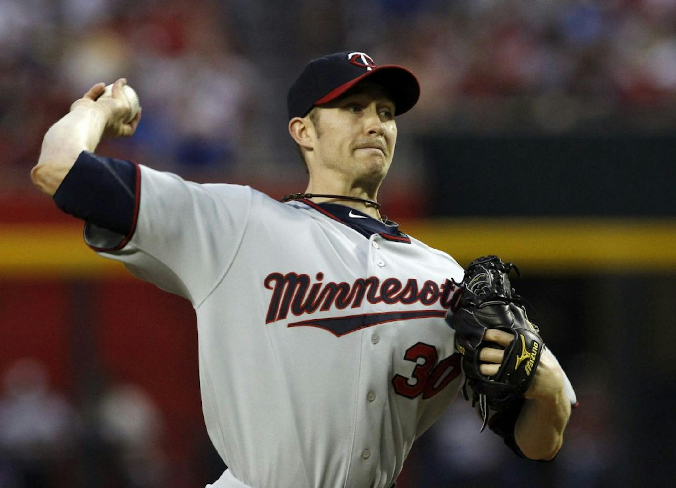 Minnesota Twins' Scott Baker (30) throws against the Arizona Diamondbacks during the first inning of an MLB interleague baseball game Saturday, May 21, 2011, in Phoenix.