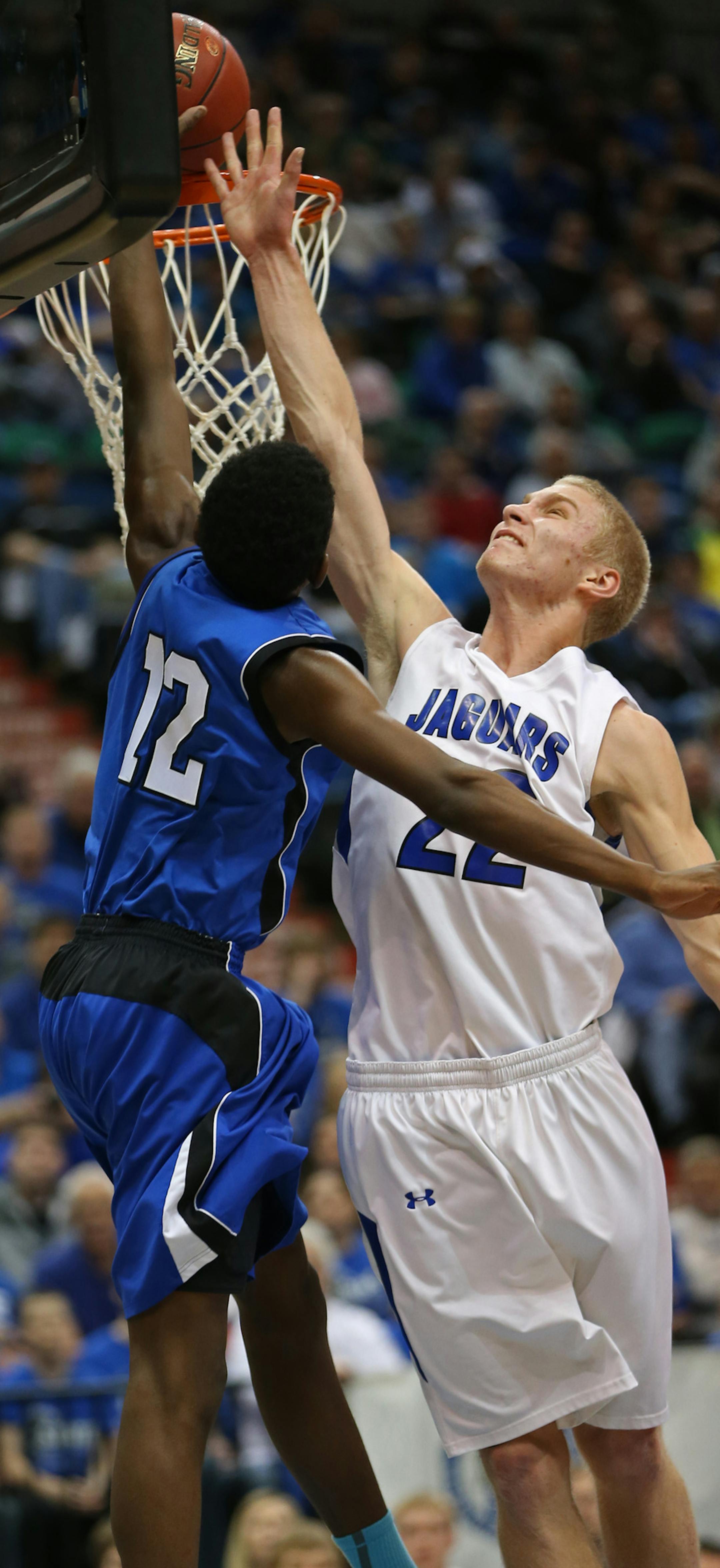 (left to right) Fond du Lace Ojibwe's Davonte Williamson dunked the ball as Belgrade-Brooten-Elrosa's James Keufler defended.] Boys Basketball Tournament, Fond du Lac Ojibwe vs. Belgrade-Brooten-Elrosa, Class 1A game at Target Center, 3/13/14. Bruce Bisping/Star Tribune bbisping@startribune.com Davonte Williamson, James Keufler/roster.